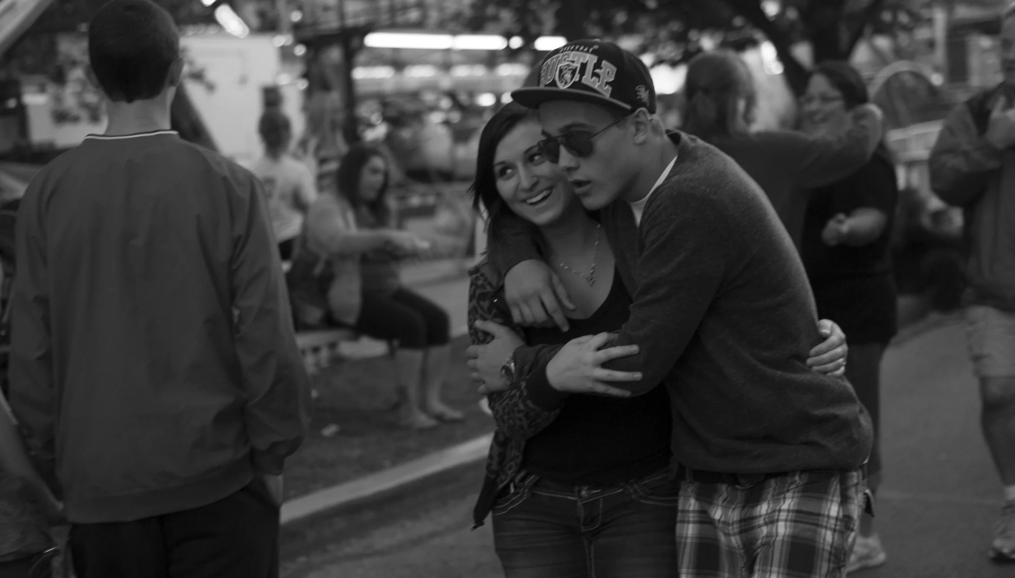 A young couple embraces during the Summer Fest in Evansville, Indiana. 