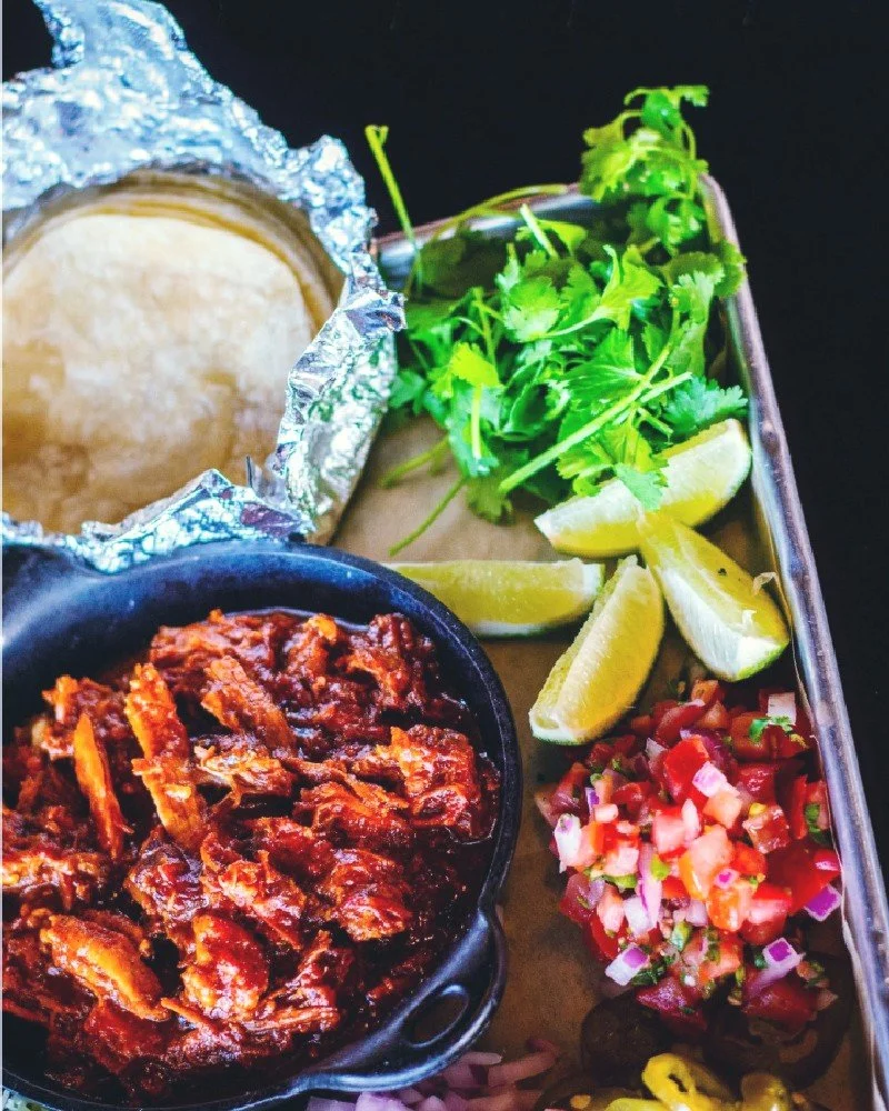 What's that? 👂  It's the yummy sounds we hear every Tuesday when folks dig into Hopsaint's carnitas plate. It has ALL the fixings to build a taco your way.  1/2 pound pulled pork, Ranchero sauce, tomatoes, onions, cilantro, pickled jalape&ntilde;os,