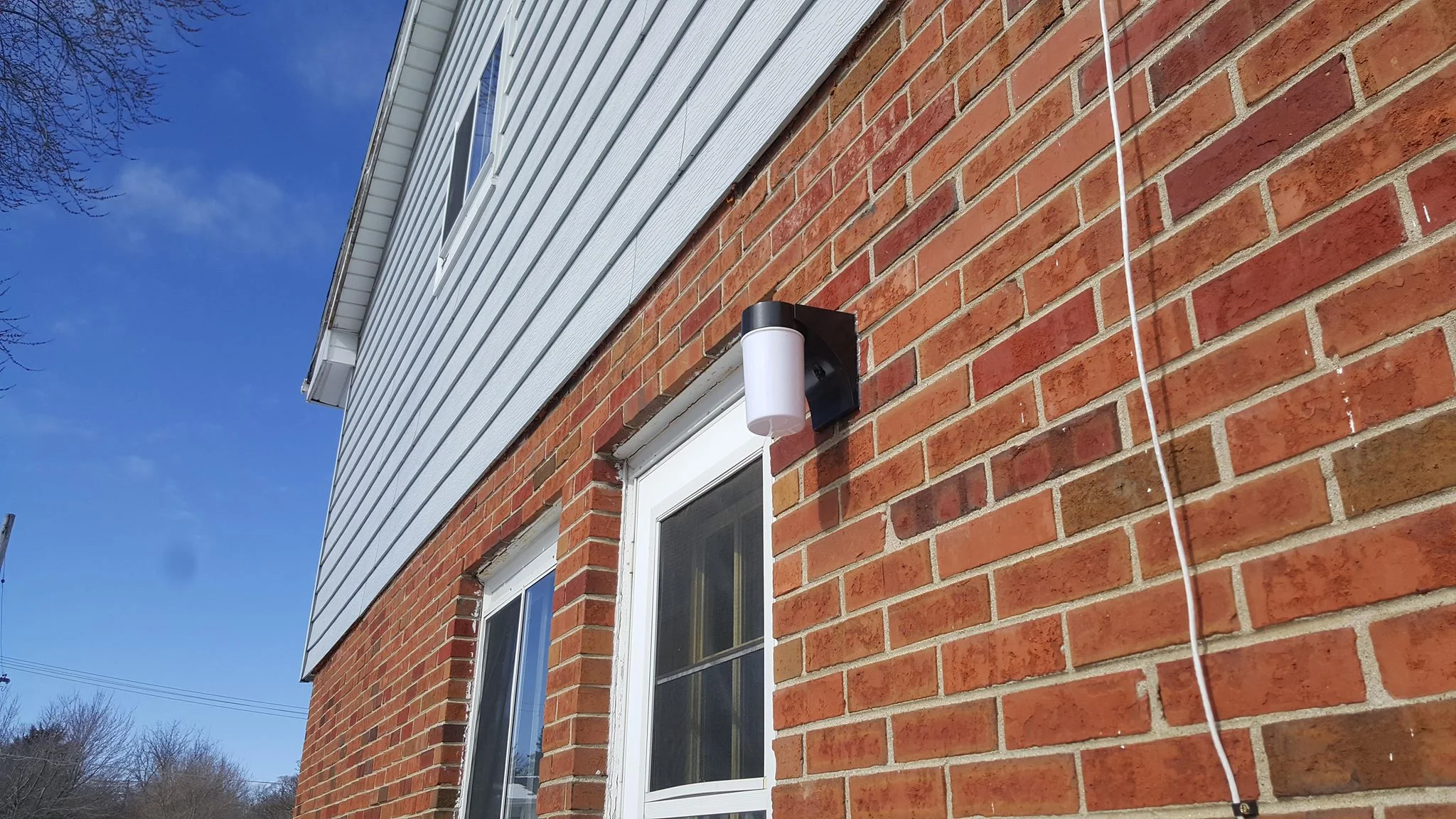 LED upgrade - Nice little LED light with a photocell just installed. With the silicone caulk beaded over it they should never need to change it in their lifetime .