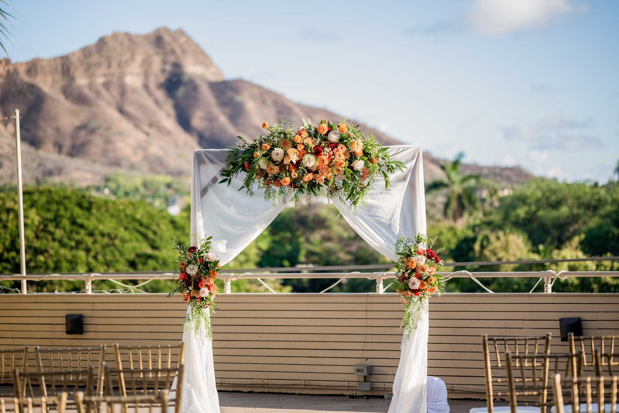 Wedding-Arch-With-Fall-Colored-Florals.jpg