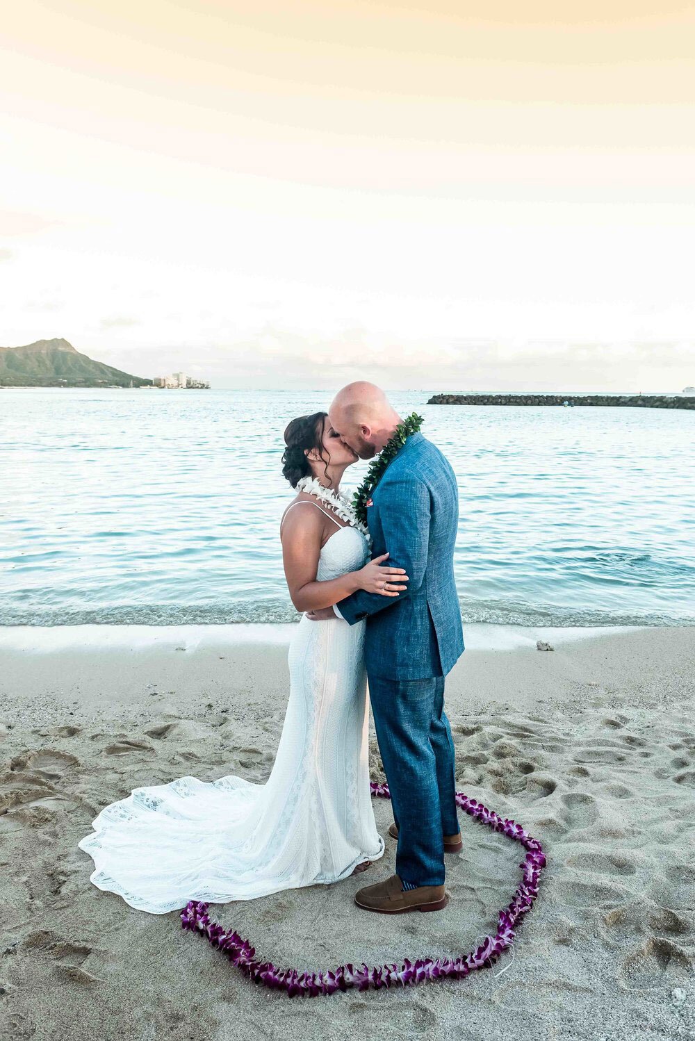 waikiki-beach-wedding-couple-kissing-in-flower-circle.jpg