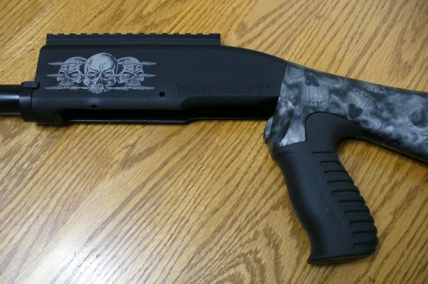 Skulls Laser Engraved On Anodized Gun Surface