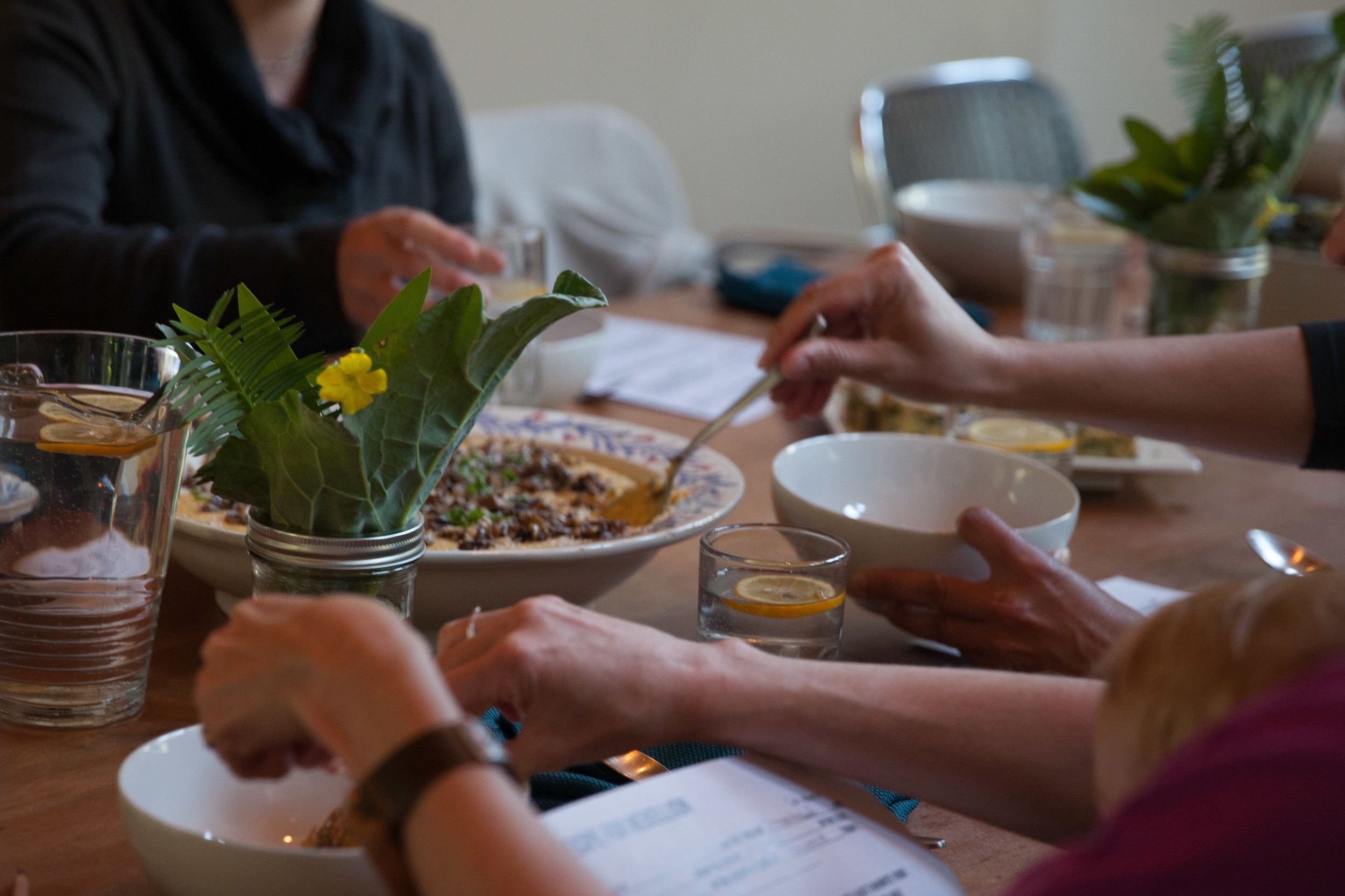  Guests serve themselves out of of shared family style platters.  Photo by Tina Case 