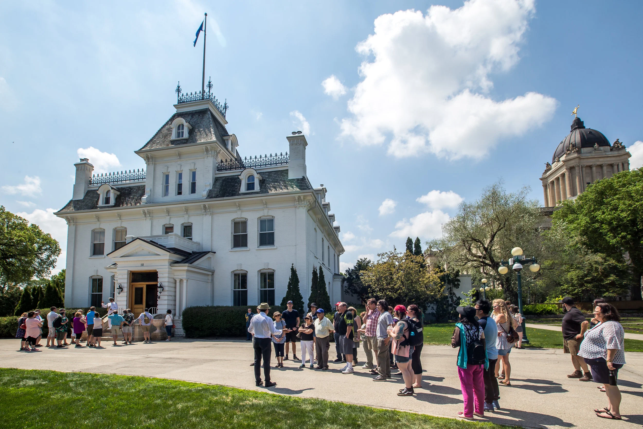 Guests line up outside Government House for tours during Doors Open - the official residence of the Lieutenant Governor of Manitoba.