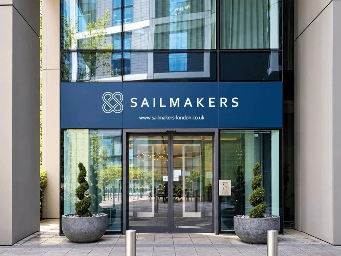 Sailmakers building entrance with its sign above the glass doors.