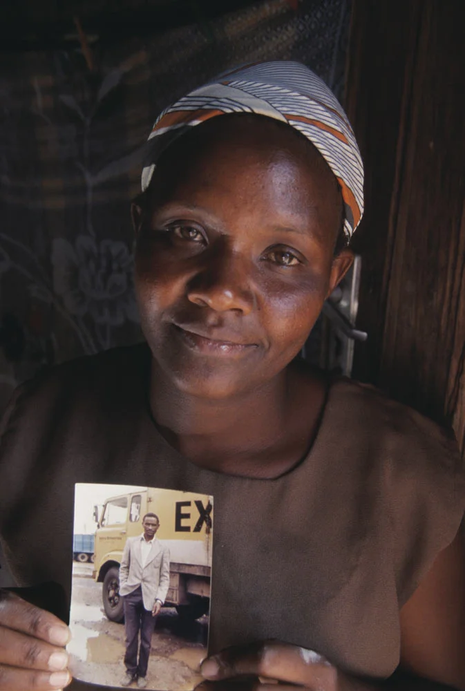 Widow with husband’s photo