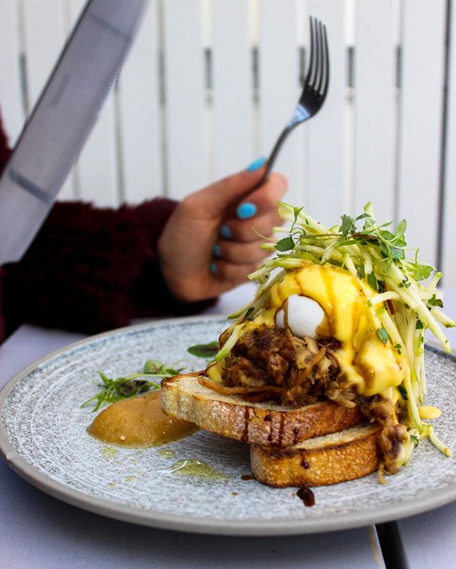 Slow-Cooked Pulled Pork Benedict on sourdough. 🍴 We hope you have a knife and fork held firmly in each hand. Time to cut through those mad Saturday brunch cravings. 🥚 🥚