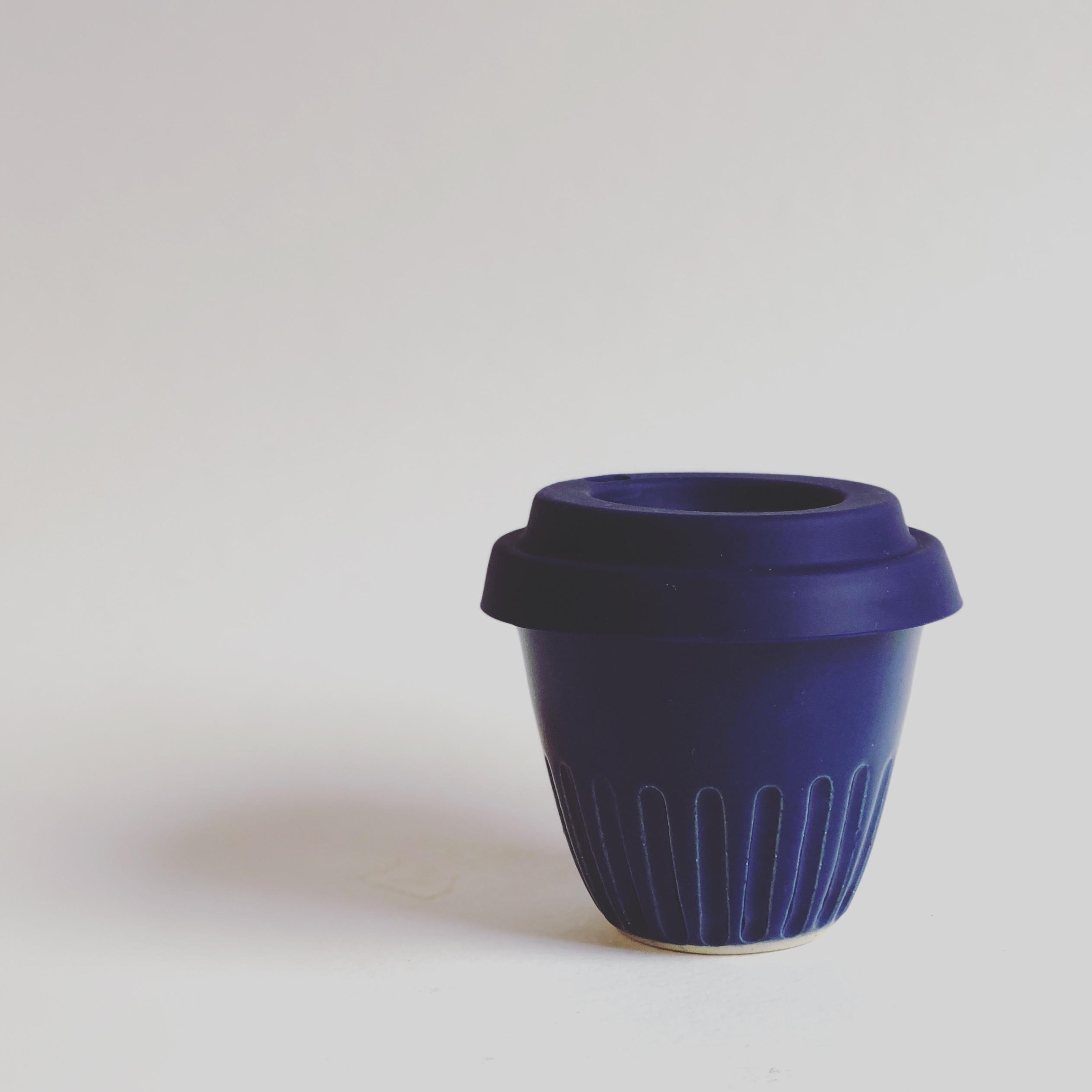 A blue ceramic keep-cup.