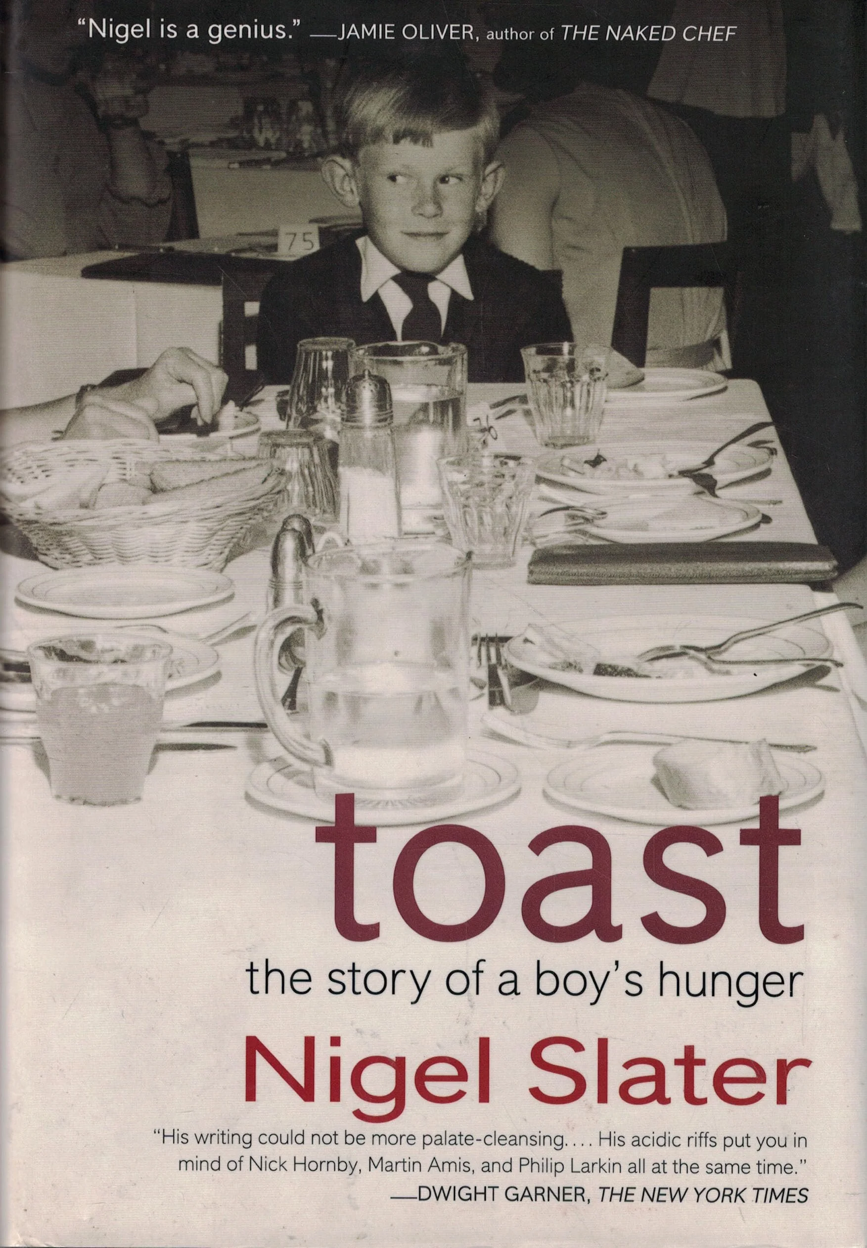 Cover of Nigel Slater’s memoir Toast: the story of a boy’s hunger. A photo of a boy in a dinner suit is placed in the centre. The title of the book is written at the bottom. Harper Collins Australia