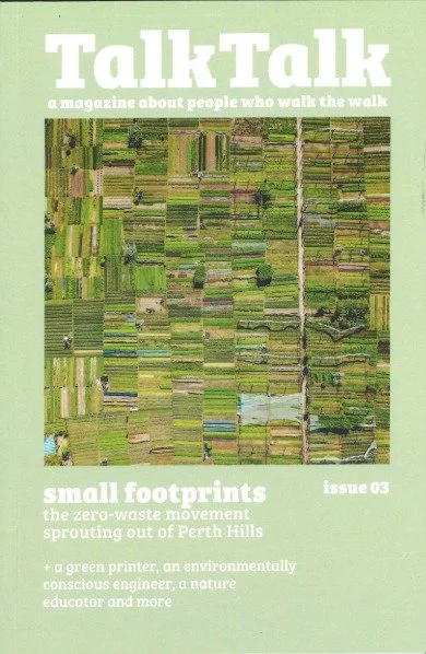 Magazine cover of TalkTalk with the title on top and underneath it says 'a magazine about people who walk the walk'. Underneath that is an overhead shot of farmland. Then underneath that is the text 'small footprints' with 'issue 03' next to it.