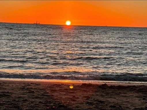 A bright orange sunset at Brighton Beach, Victoria