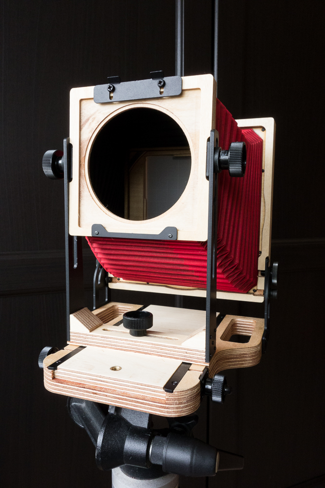 The camera's front standard, set in the 'rise' position.