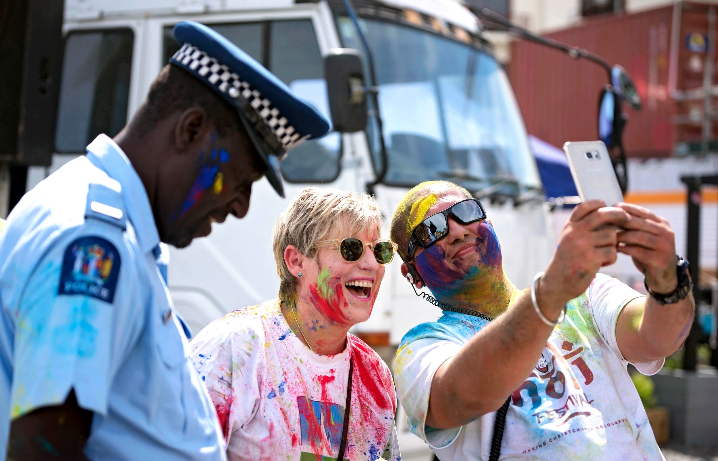 Constable Philemon Goto - Ethnic Liaison Officer of Canterbury Police, Christchurch's Mayor Lianne Dalziel and Hitesh Sharma, the main organiser of Christchurch's 2016 Holi celebrations