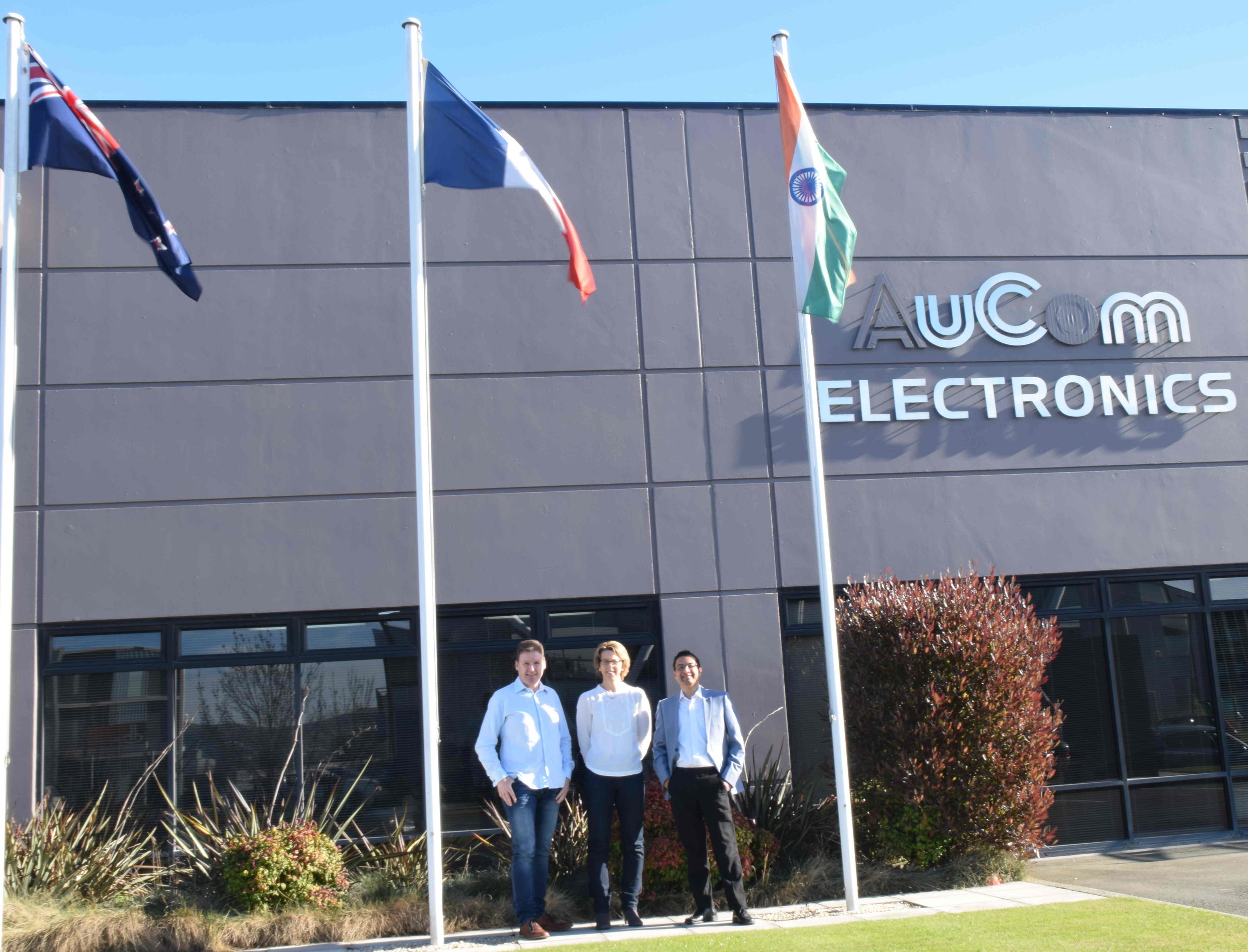  Indian flag outside AuCom's office; Brent Archer (left), with Shirish (right), and Mandy (company's HR Head) 