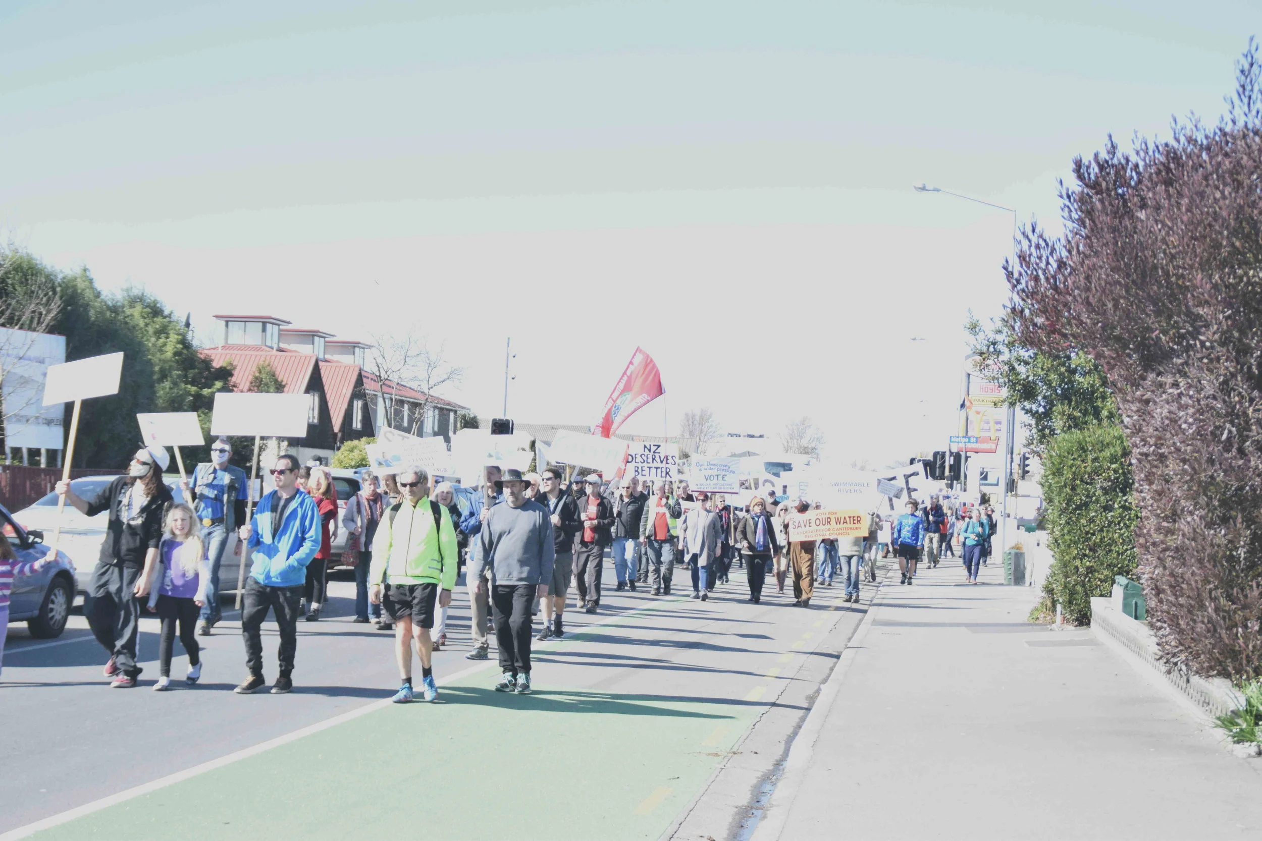 Anti-TPPA protestors marching on Riccarton Road in Christchurch on September 10