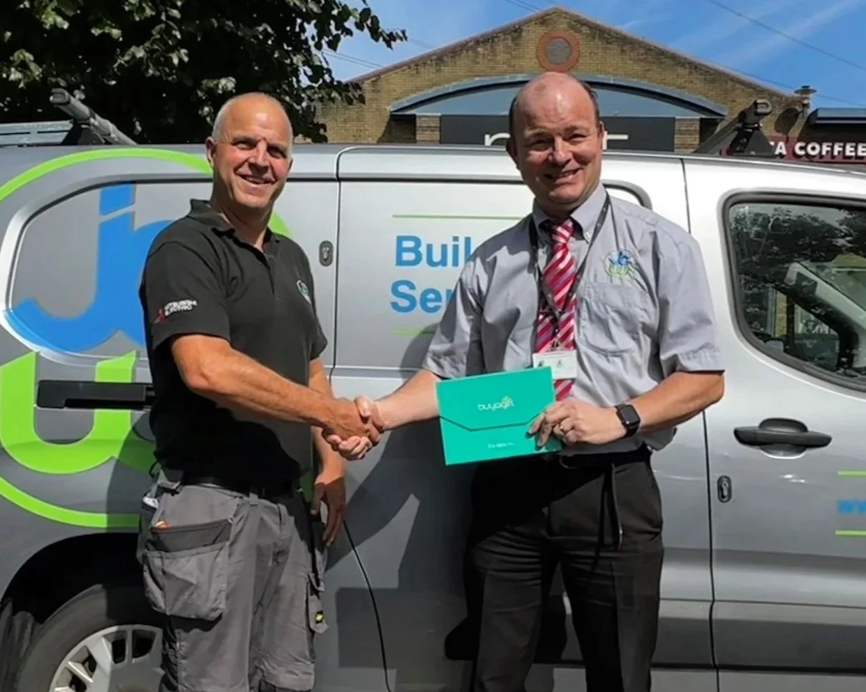 Gary celebrating other JCW long serving staff.jpg