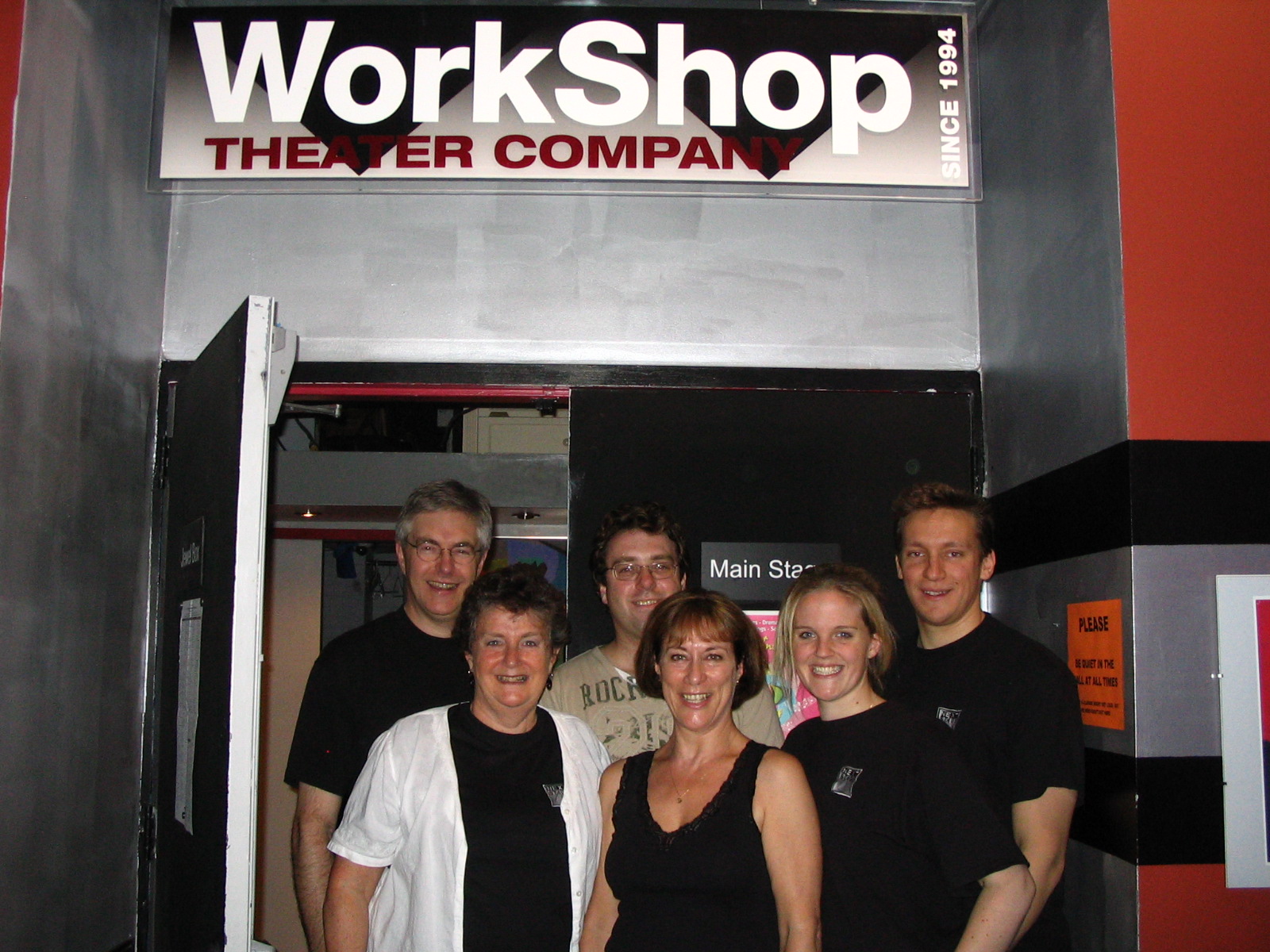 The cast and crew of Intimate Exchanges at the entrance to The Workshop Theatre