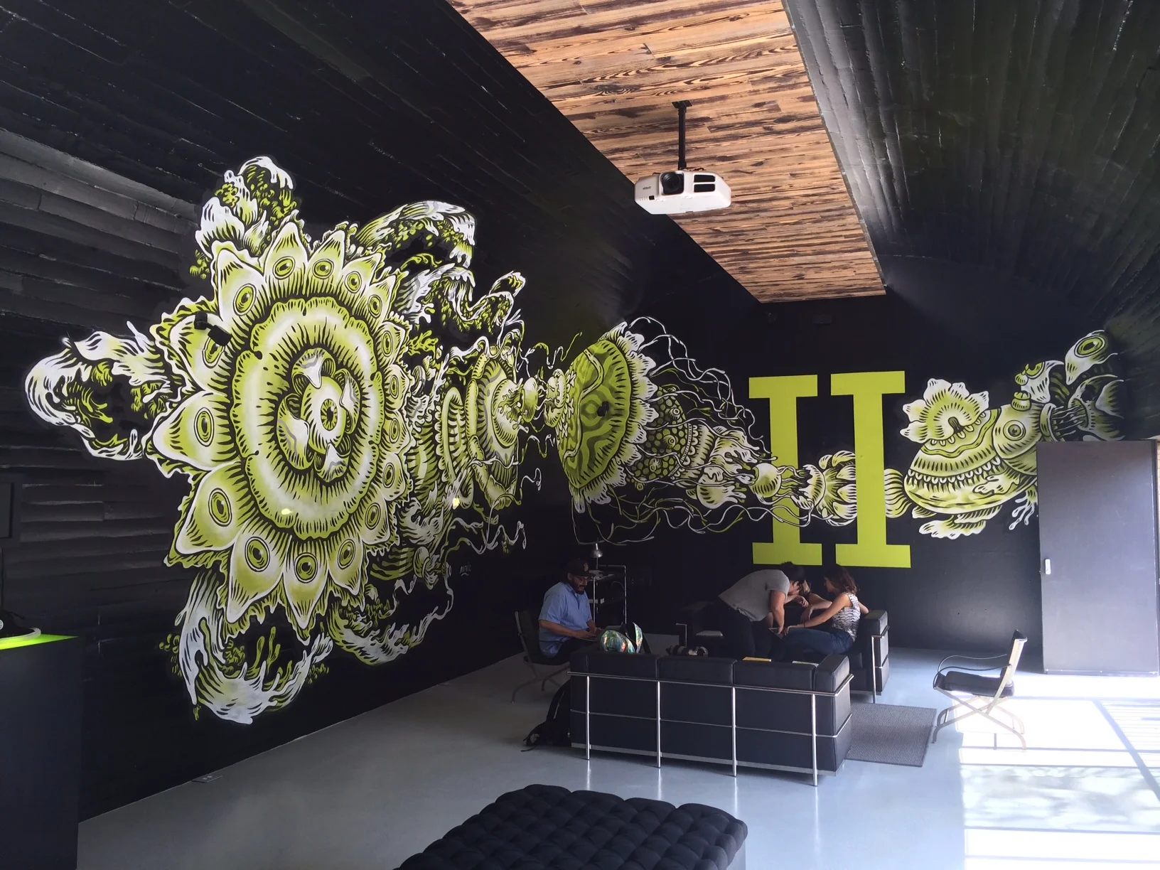  The mural was a commissioned painting by a local Mexican artist. The piece was hand painted onto vinyl covered walls and then removed after the event. 