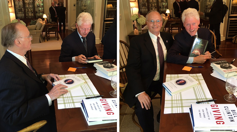 President Clinton admiring his copy of The Powers while visiting at Mark's home.