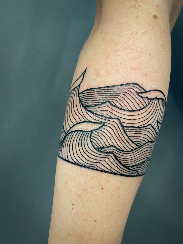 Lineart wave forearm tattoo 3