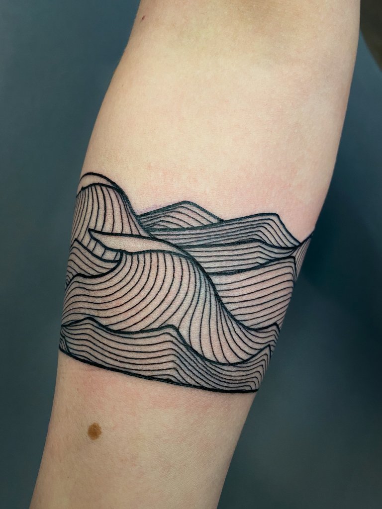 Lineart wave forearm tattoo 2