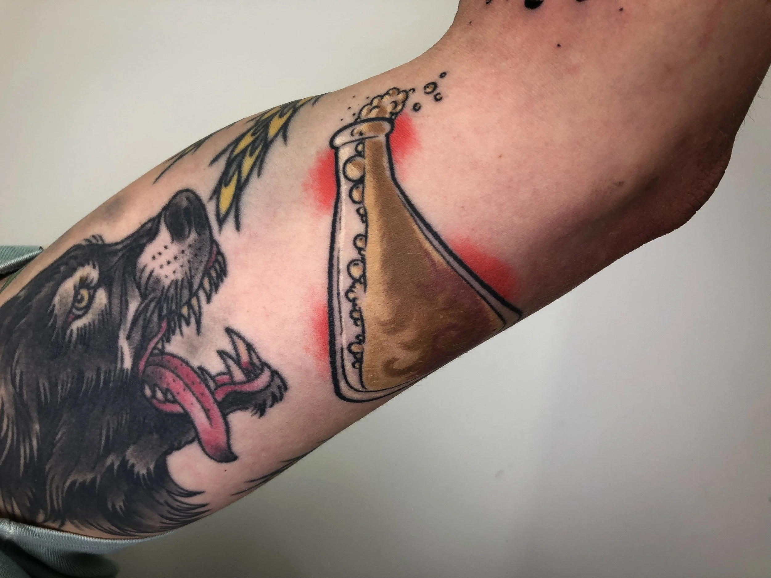 brewer's beaker and wolf neotraditional tattoo.jpg