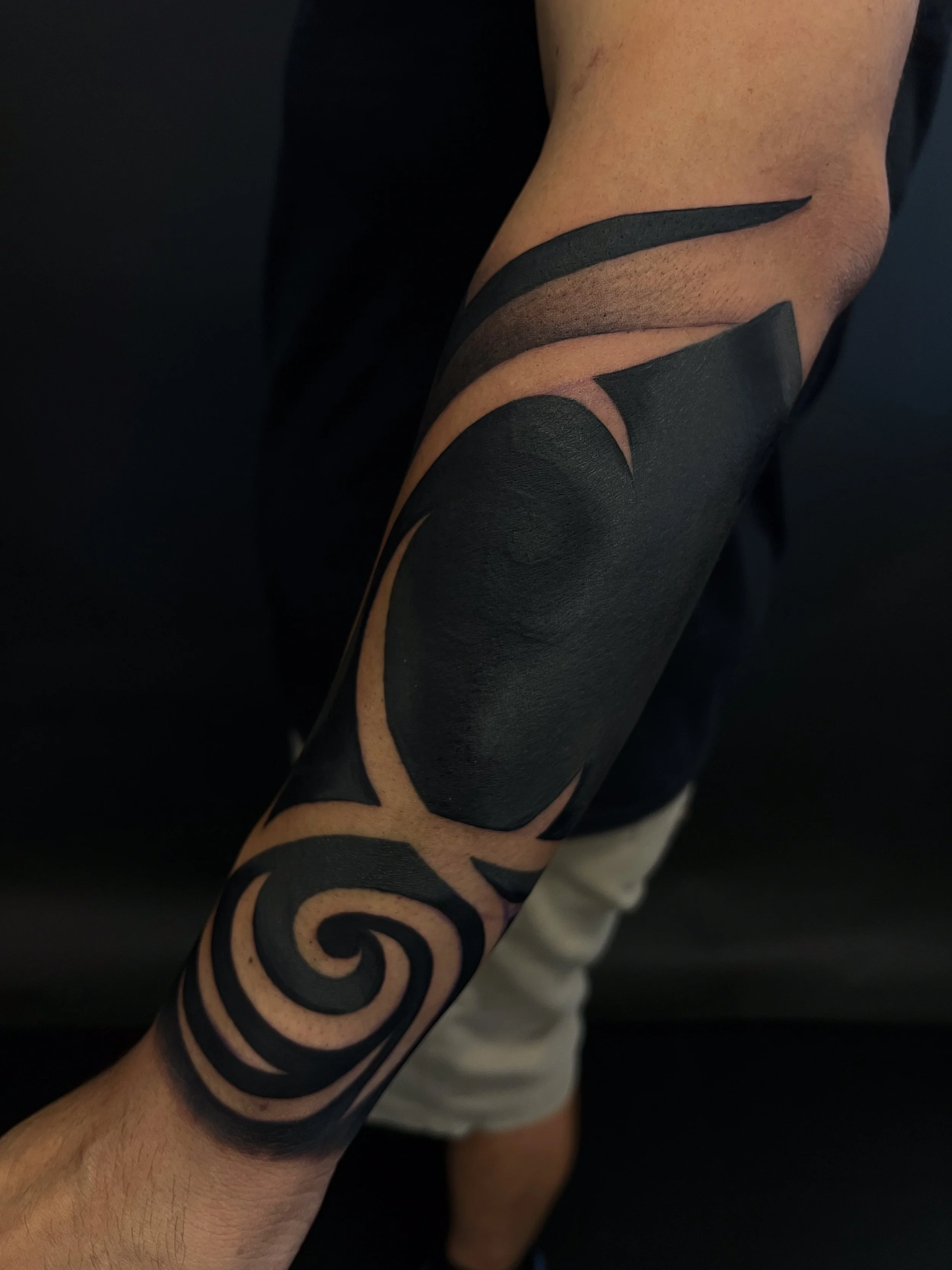 Forearm Tribal Blackout and Negative Half Sleeve-1.jpg