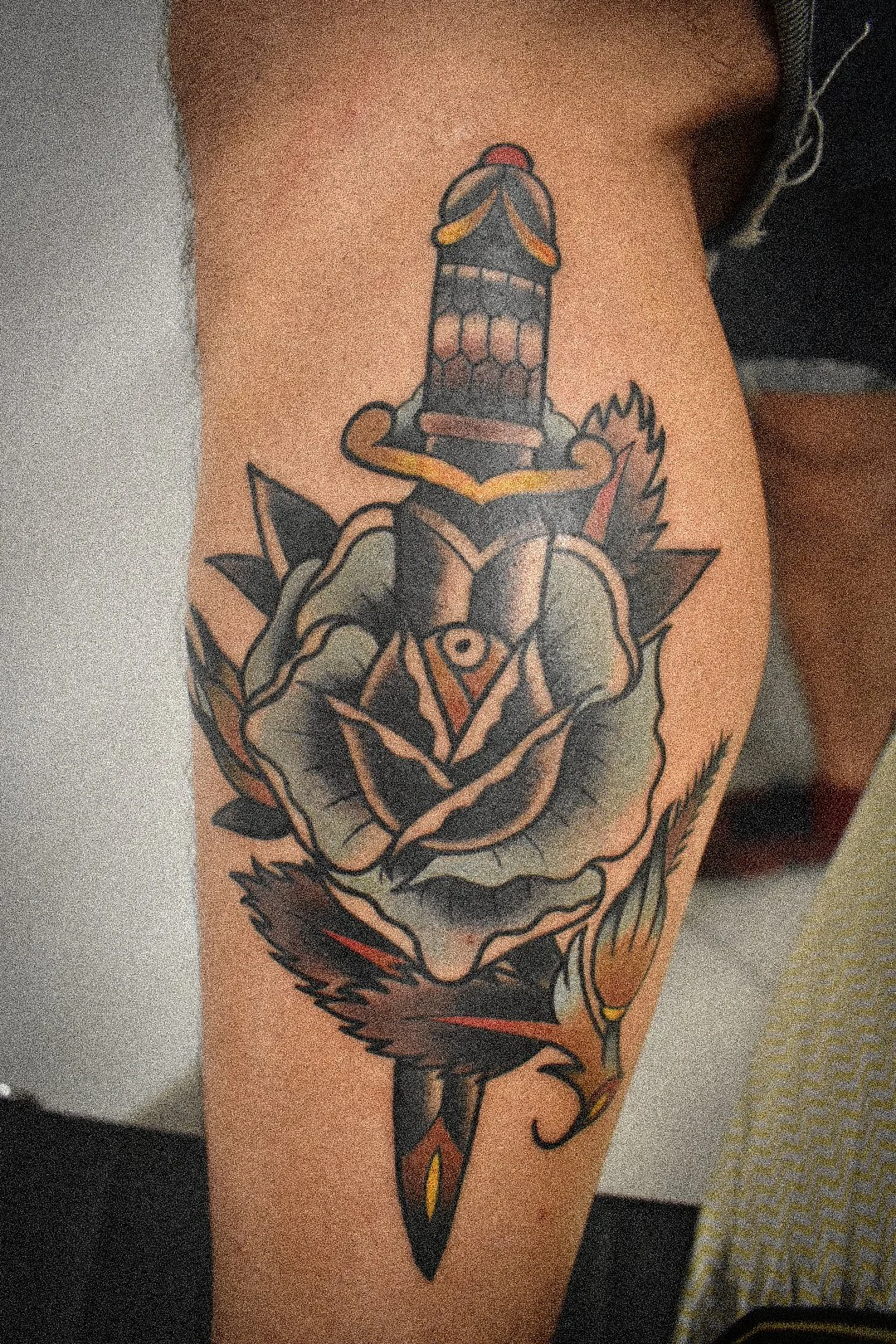 neotraditional traditional rose and dagger tattoo.jpg