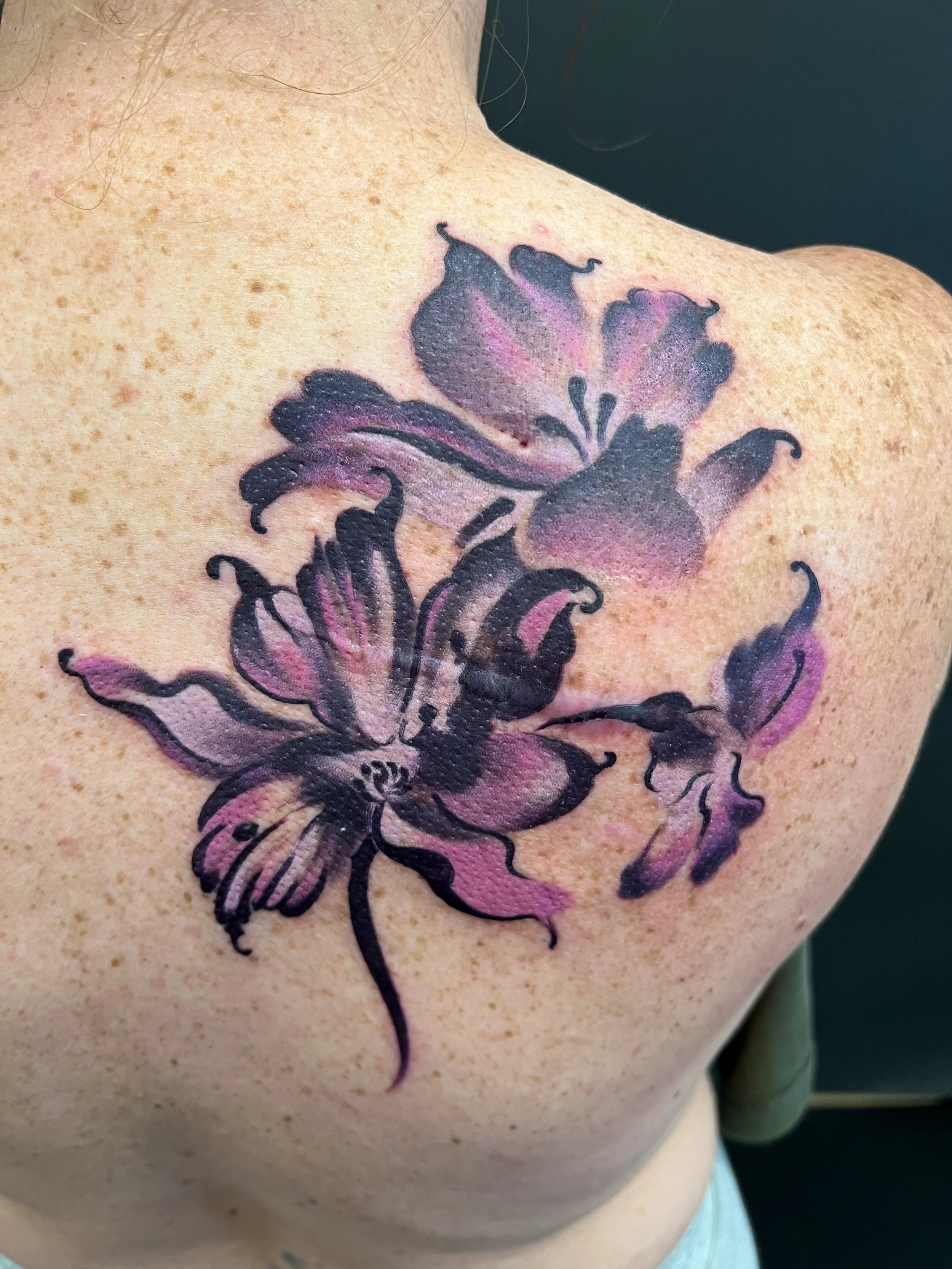 Purple and pink watercolor tattoo
