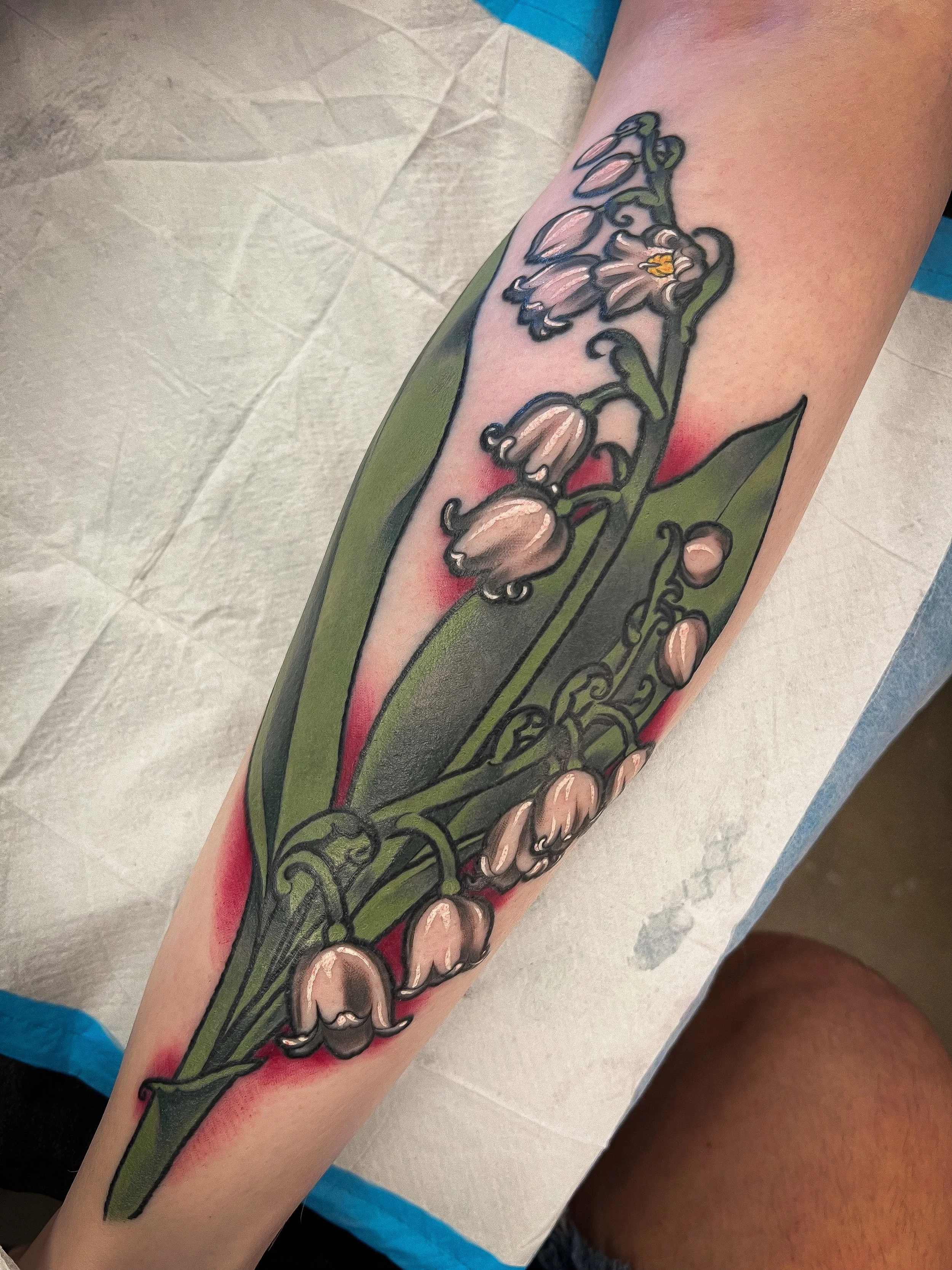 lily of the valley neotraditional color tattoo