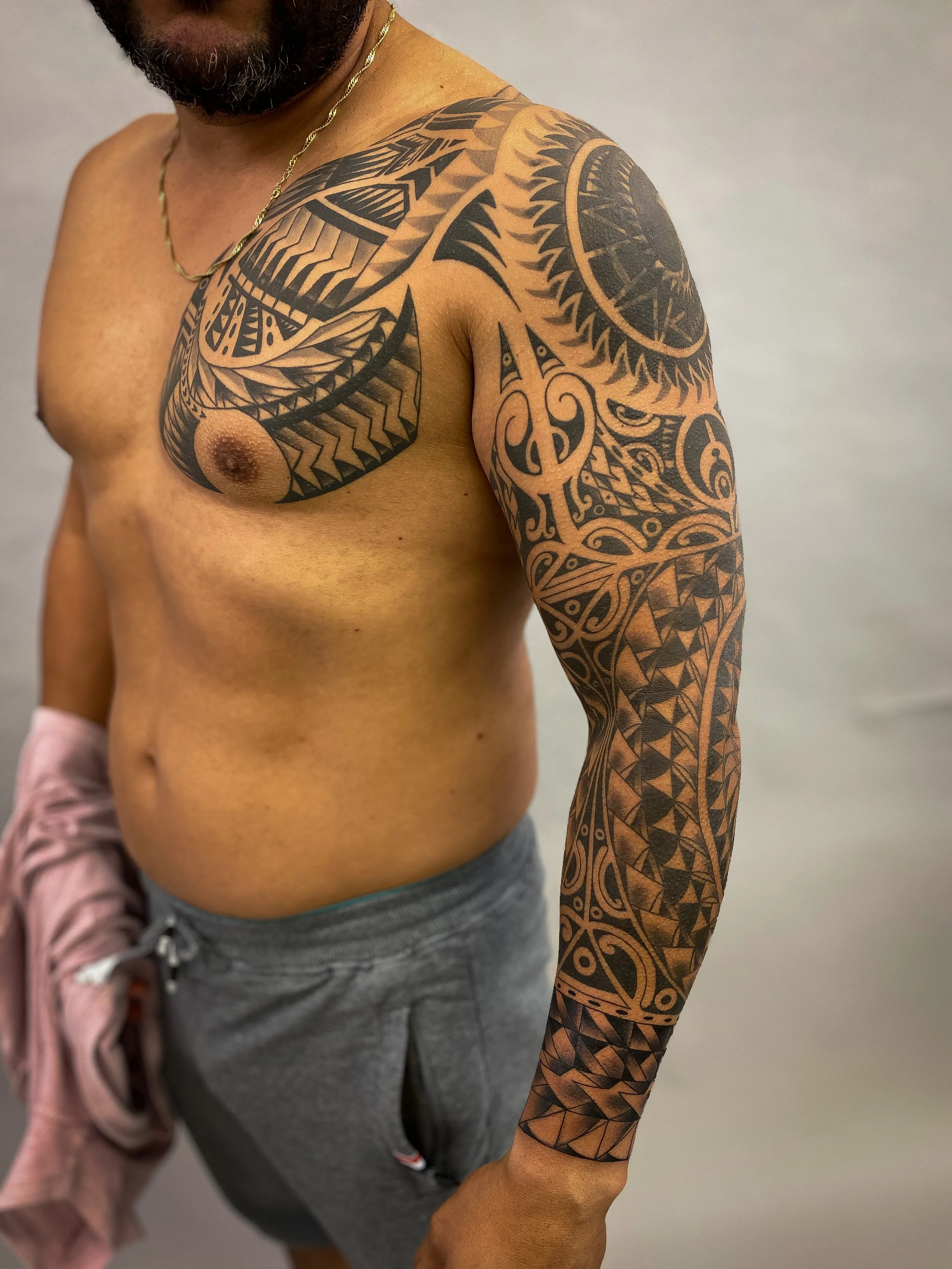 Geometric tribal polynesian chest and sleeve tattoo-1.jpg