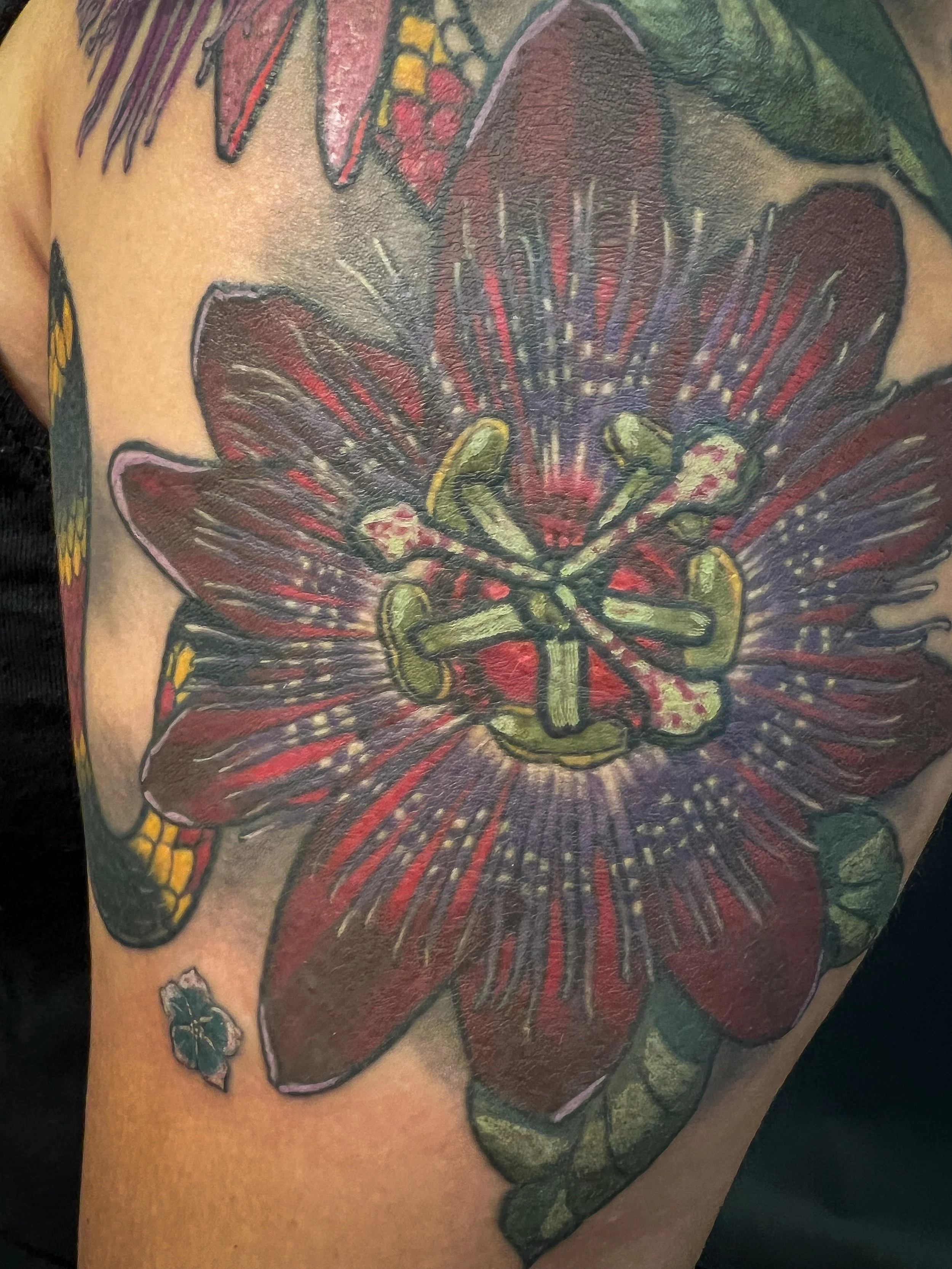 Passion flower and coral snake tattoo