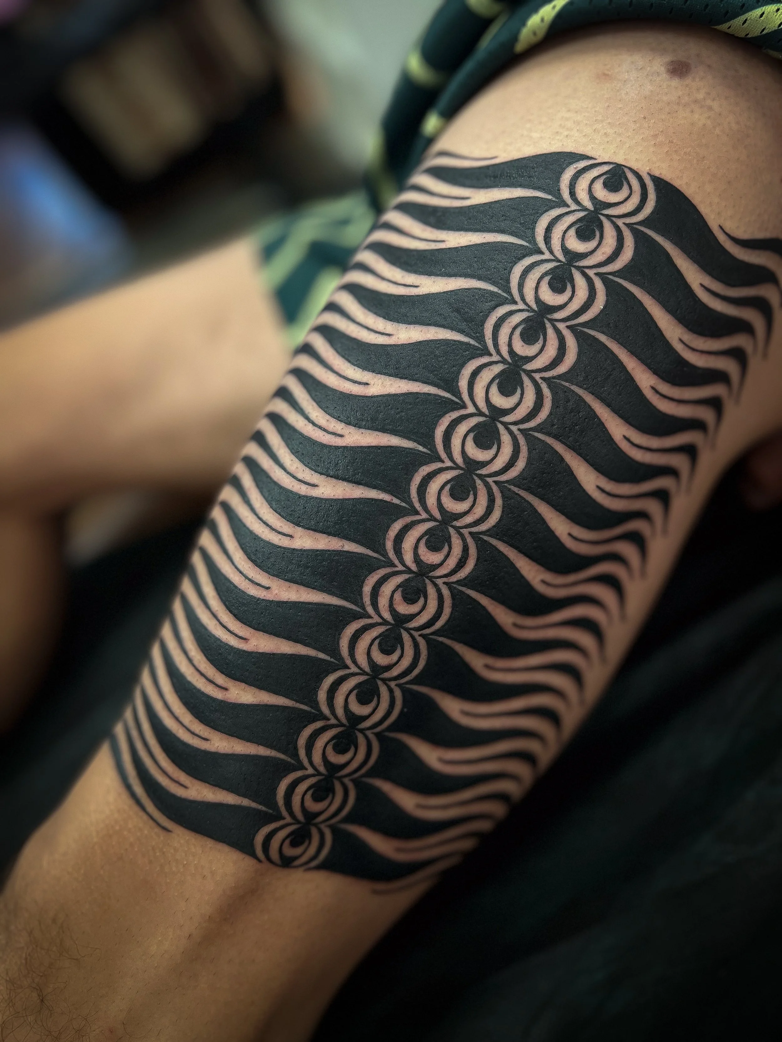 Neo Tribal Eye Flame Thigh Tattoo.jpg