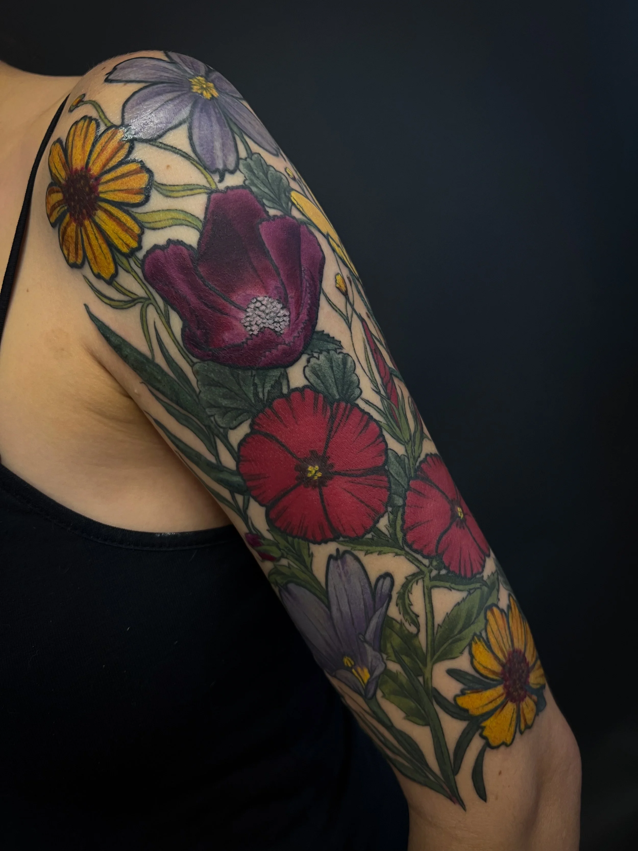Texas native wildflower half sleeve tattoo