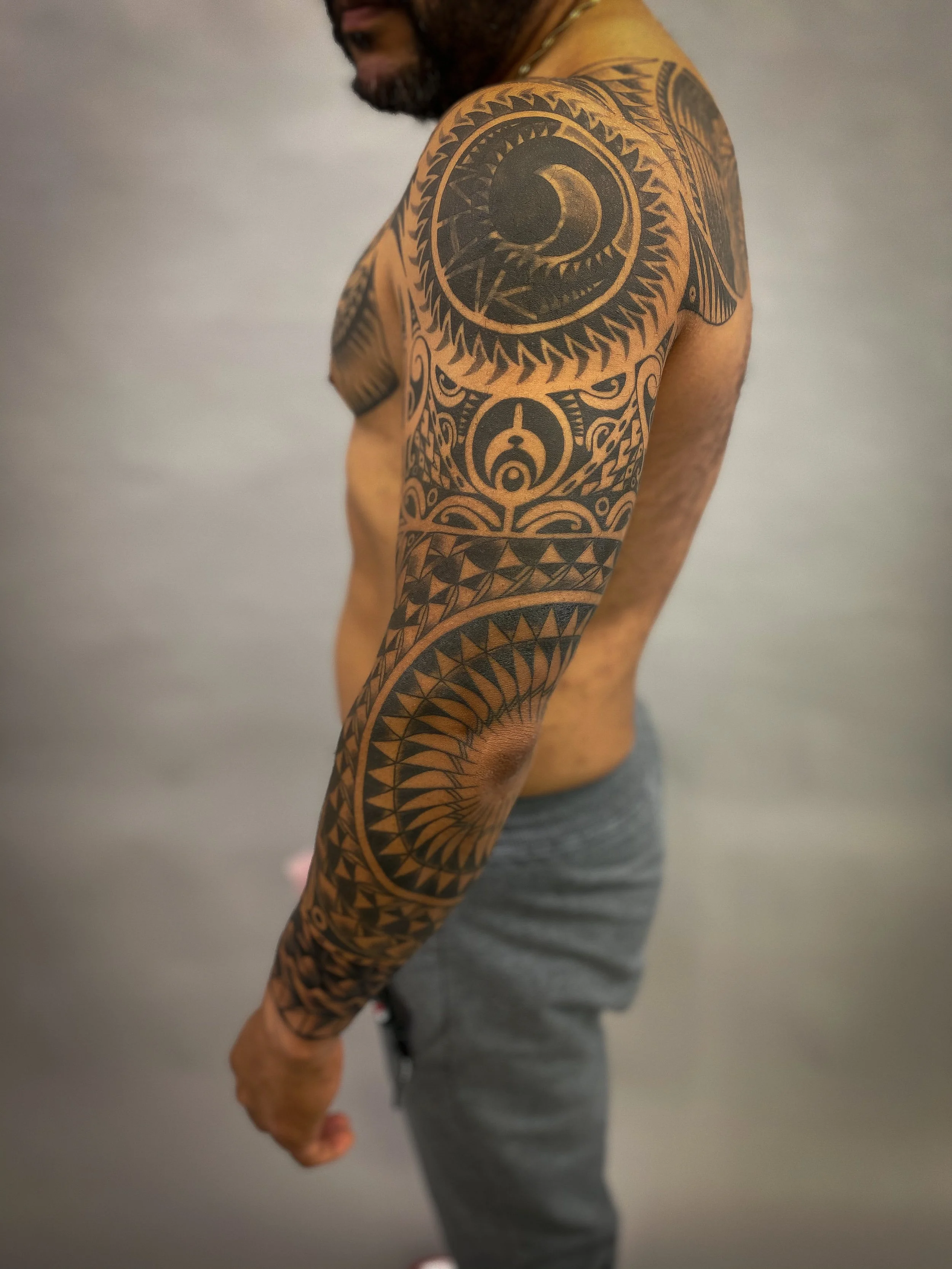 Geometric tribal polynesian chest and sleeve tattoo-2.jpg