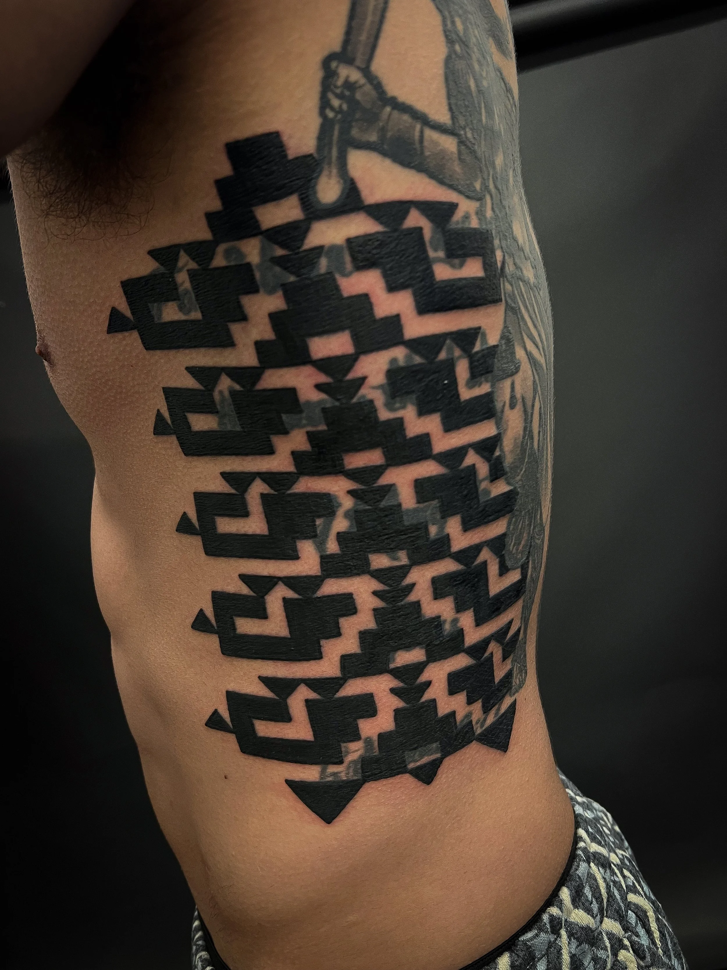 Aztec abstract shamanic tribal rib tattoo.jpg
