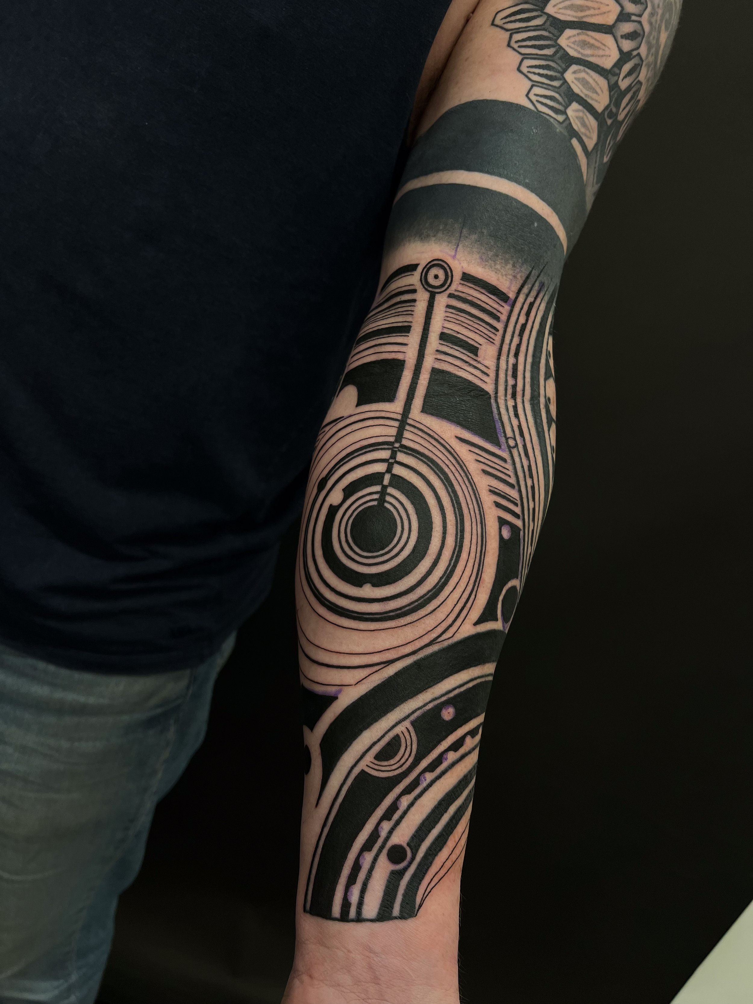 Abstract blackwork lineart forearm tattoo