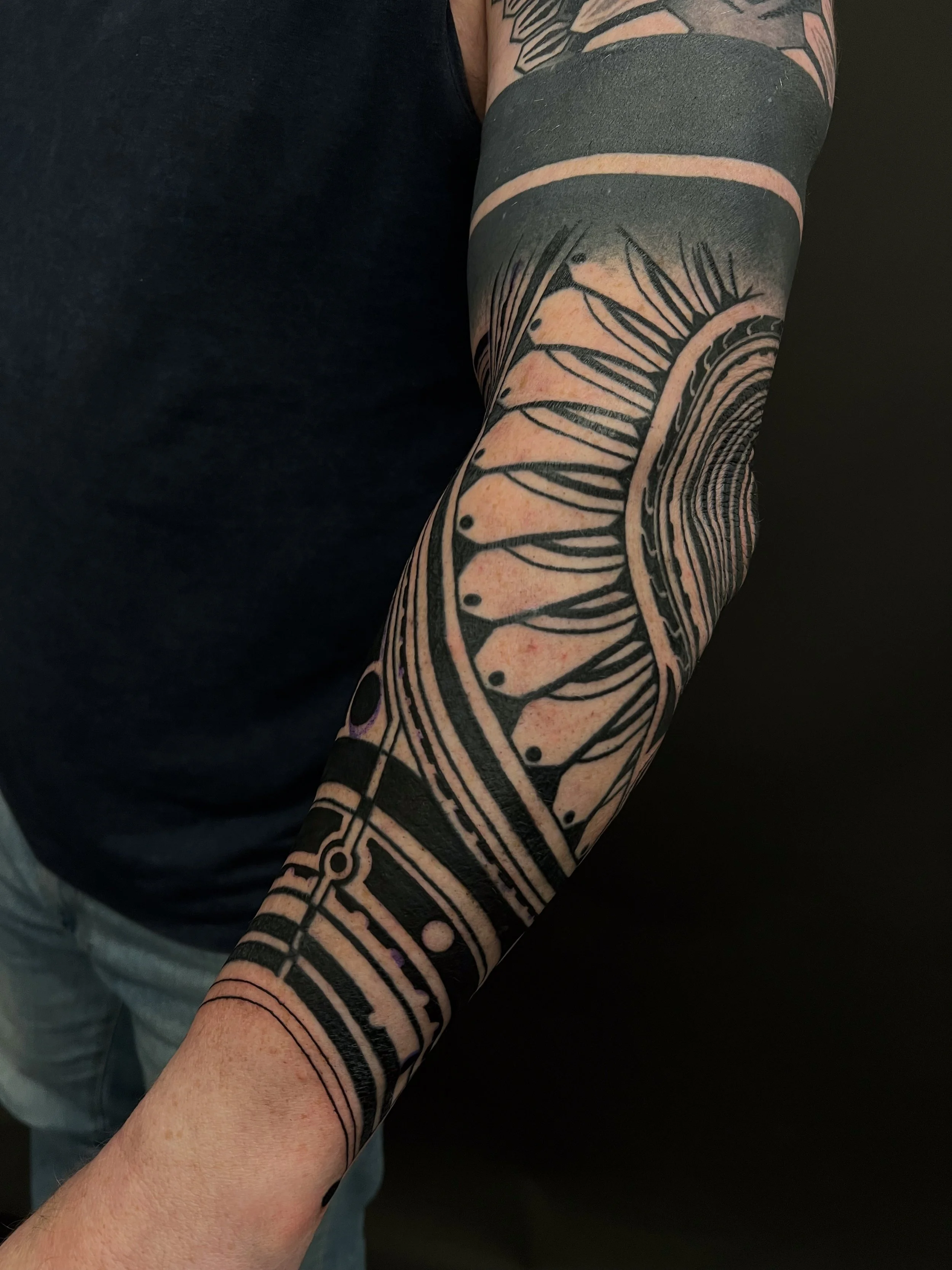 Abstract blackwork lineart forearm tattoo