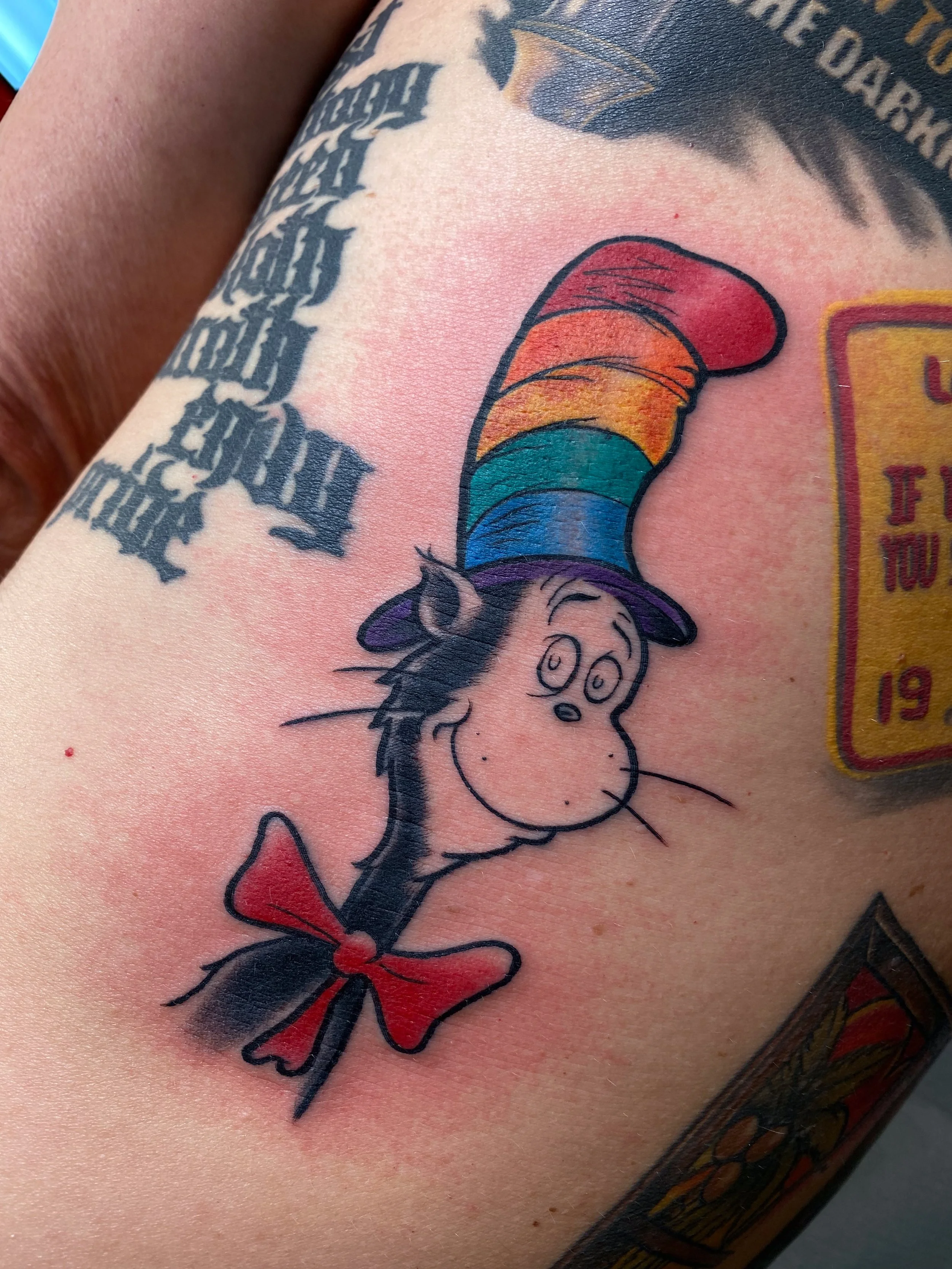 neotraditional cat in the hat dr seuss tattoo.jpg
