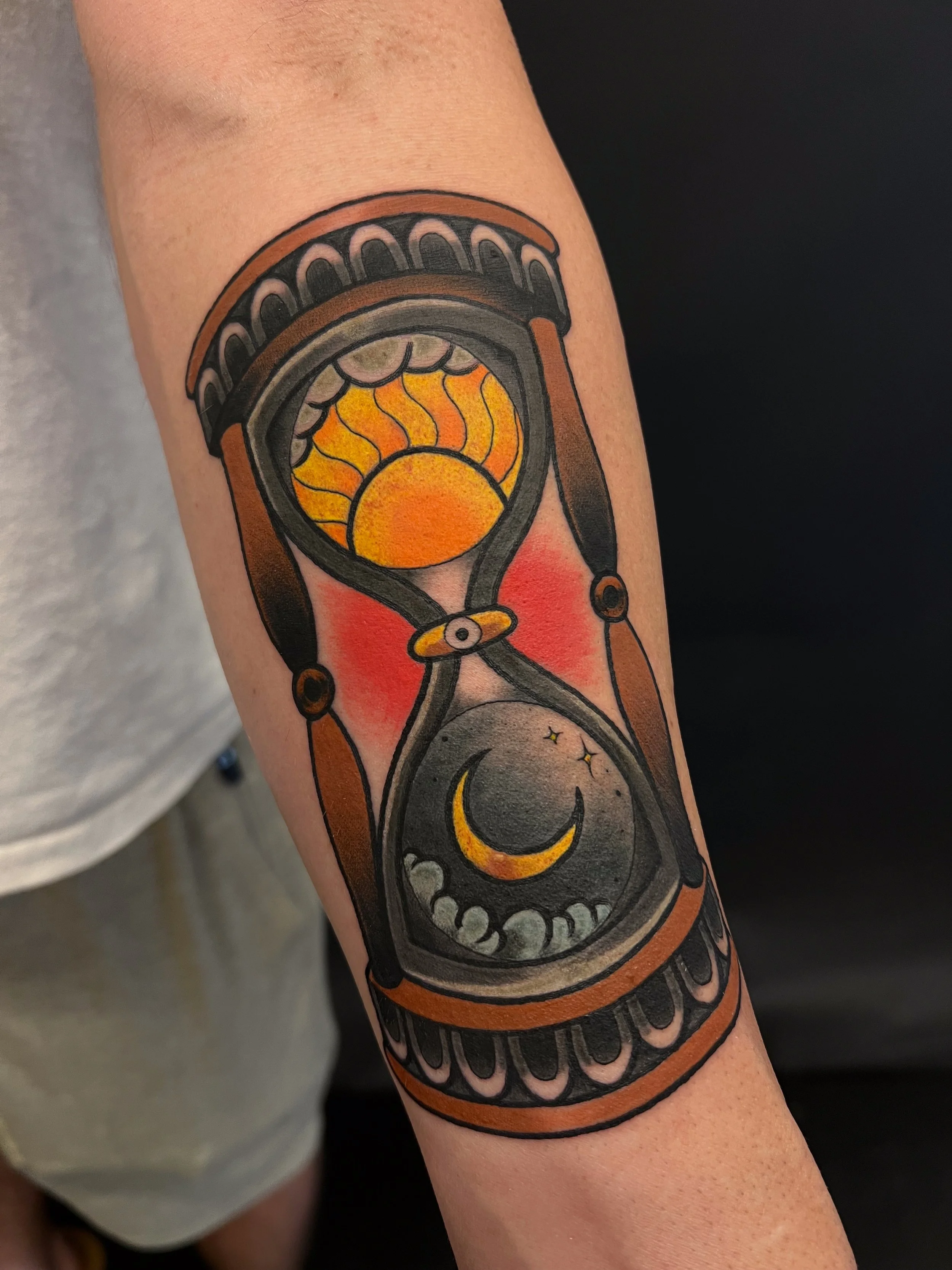 Neotraditional hourglass tattoo sun and moon.jpg