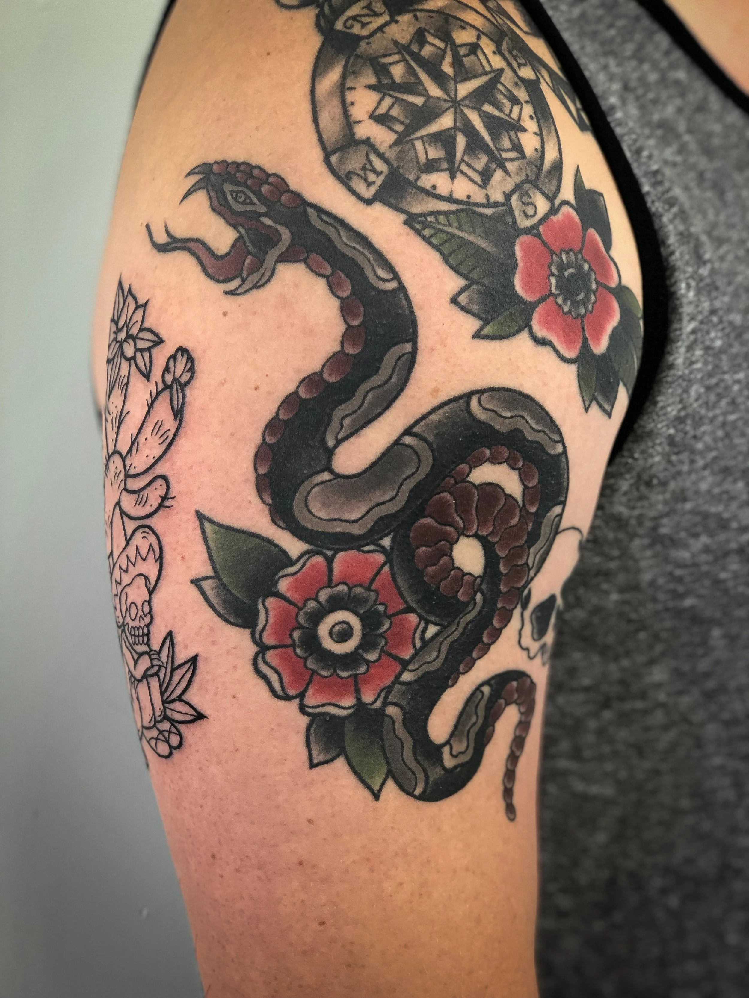 traditional snake tattoo flower tattoo.jpg