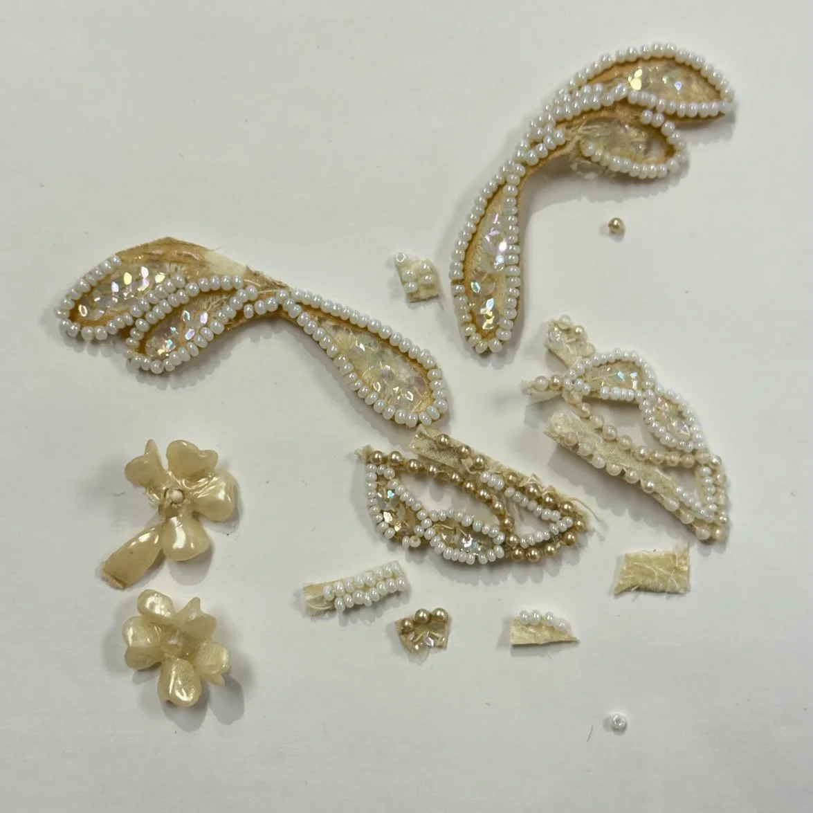 Remnants of wax flowers, and beaded sections of an old wedding crown donated to headpiece.com.
