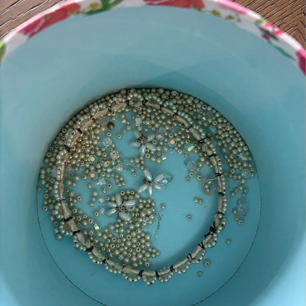 Bowl filled with vintage beads from a pearl and crystal wedding crown granddaughter took apart.