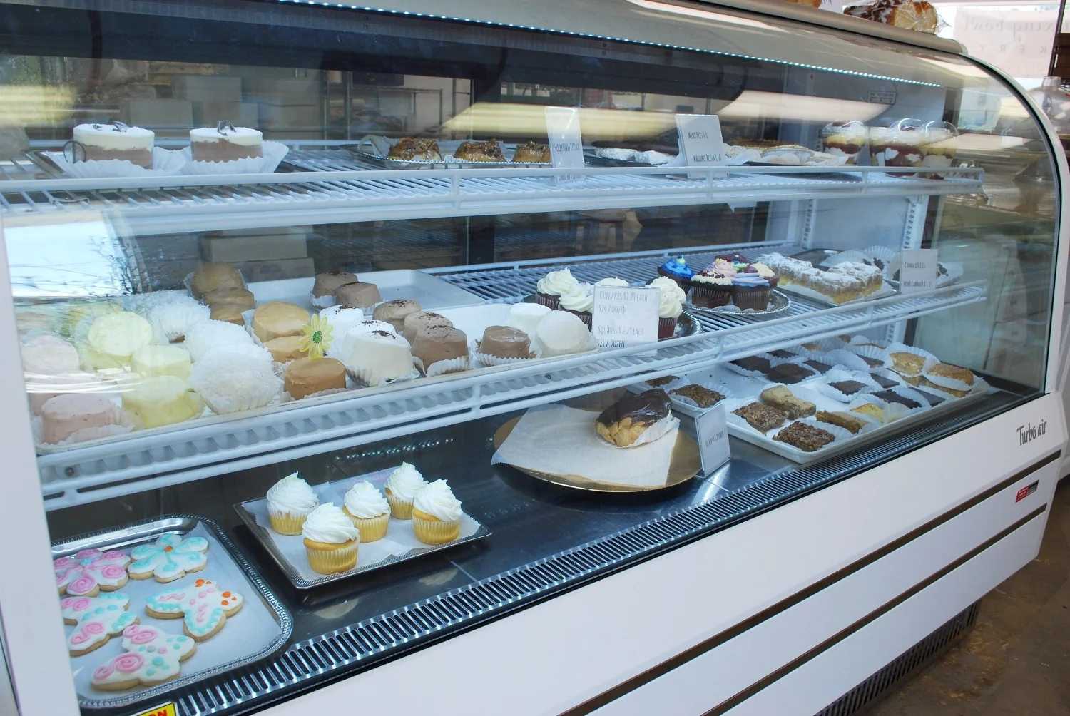 I asked what they were known for. Tracy told us they were known for their eclairs and upside down cupcakes. She didn't mention the carrot cake, but in our book they are known for their carrot cake!