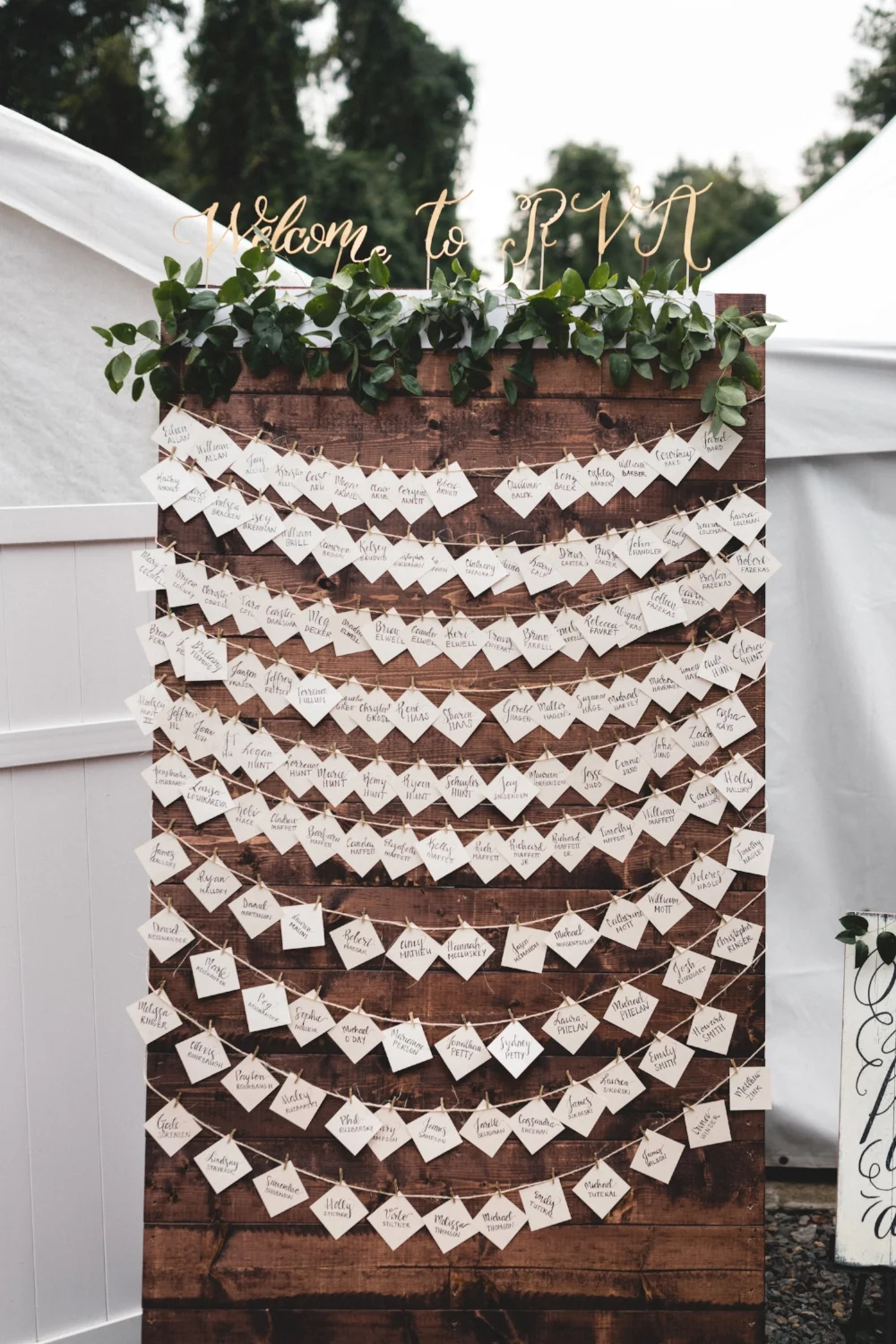 Brielle hand scripted the table seating cards inviting guests to meet her and Alex at a specific street in Richmond. Signage by Made Pretty With Paint welcomed all to RVA. The pallet display was made by Tom Culppeper and will be repurposed into an outdoor bar at the Maffett residence.
