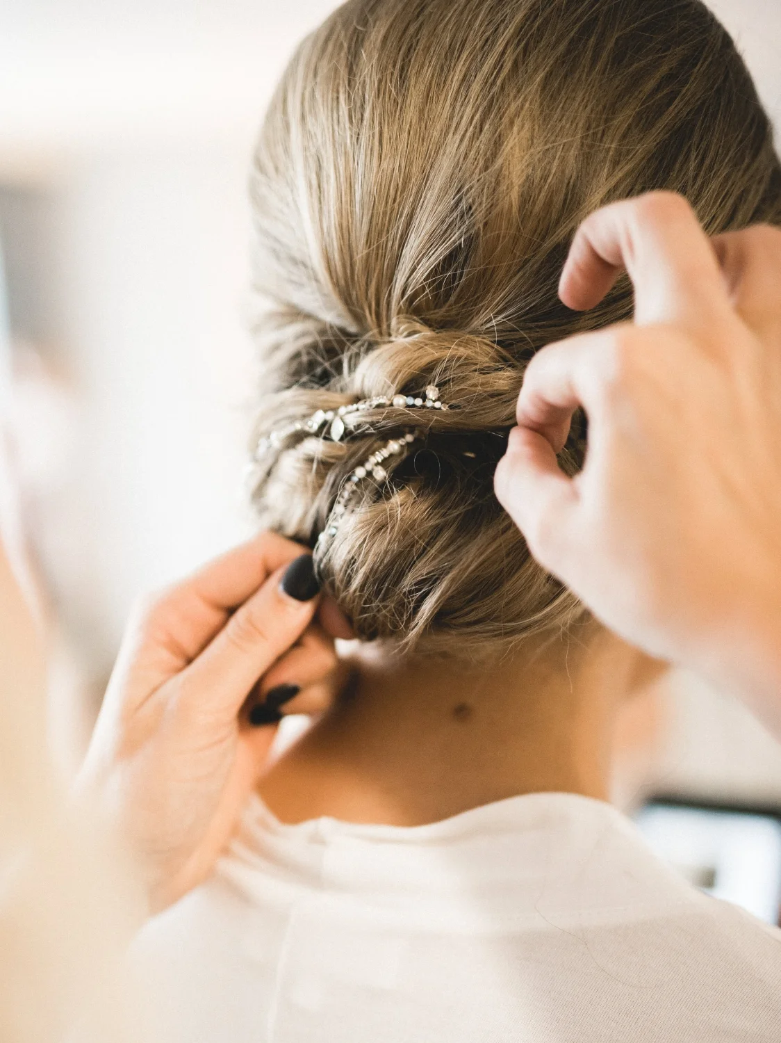 This was my favorite design idea for her wedding day! I created flexible wire hair sticks made of 14K gold and all of her favorite embellishments to be threaded into her classic chignon hairstyle.