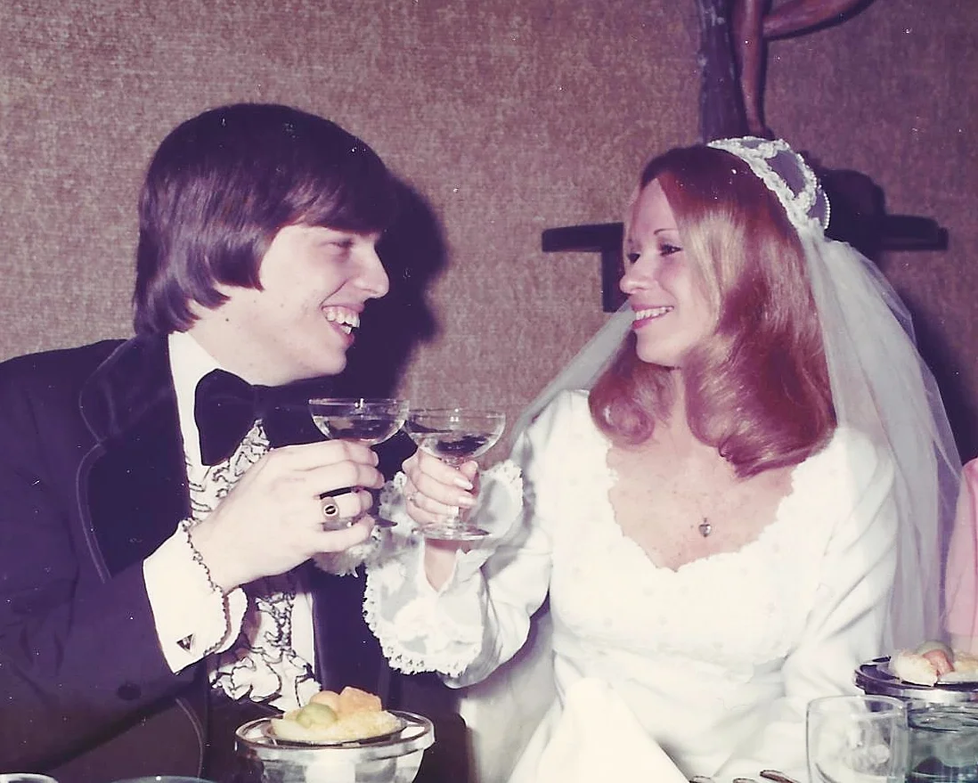 JIm and Patti Dreher toasting on their wedding day.