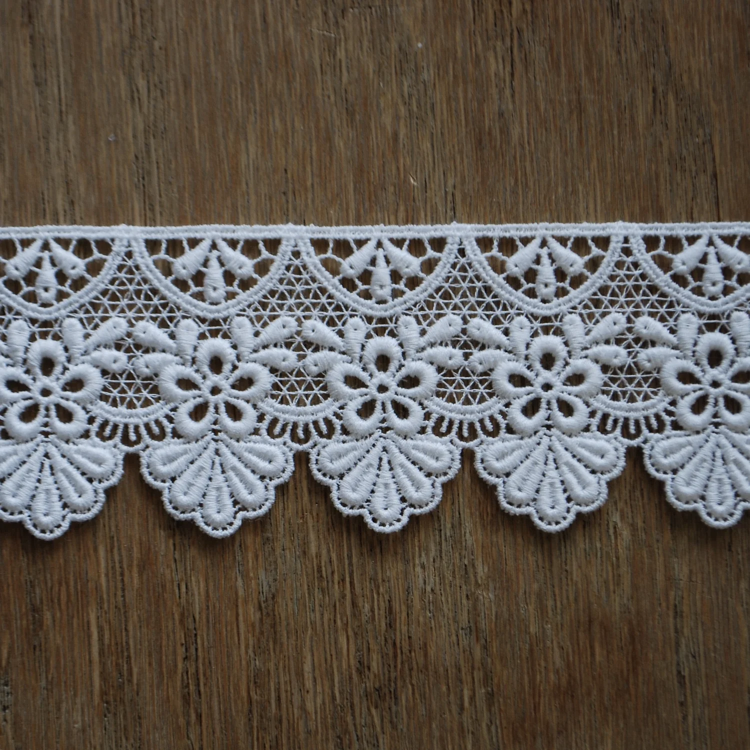 Guipure is a heavy lace created over a coarse mesh ground. It is pronounced (gee-poor).