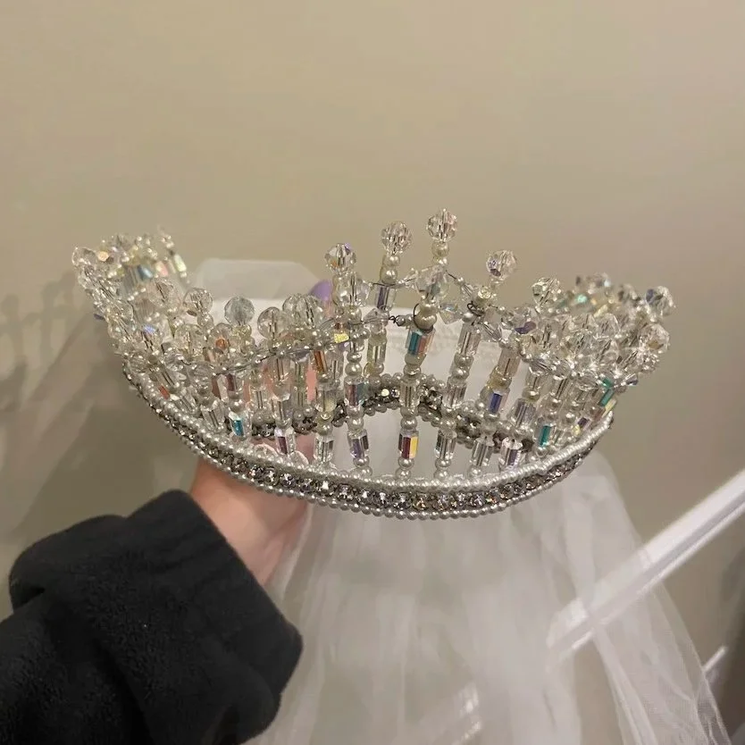 1960 vintage bridal crown with tarnished wires and discolored crystals needing restoration for granddaughter 's wedding.