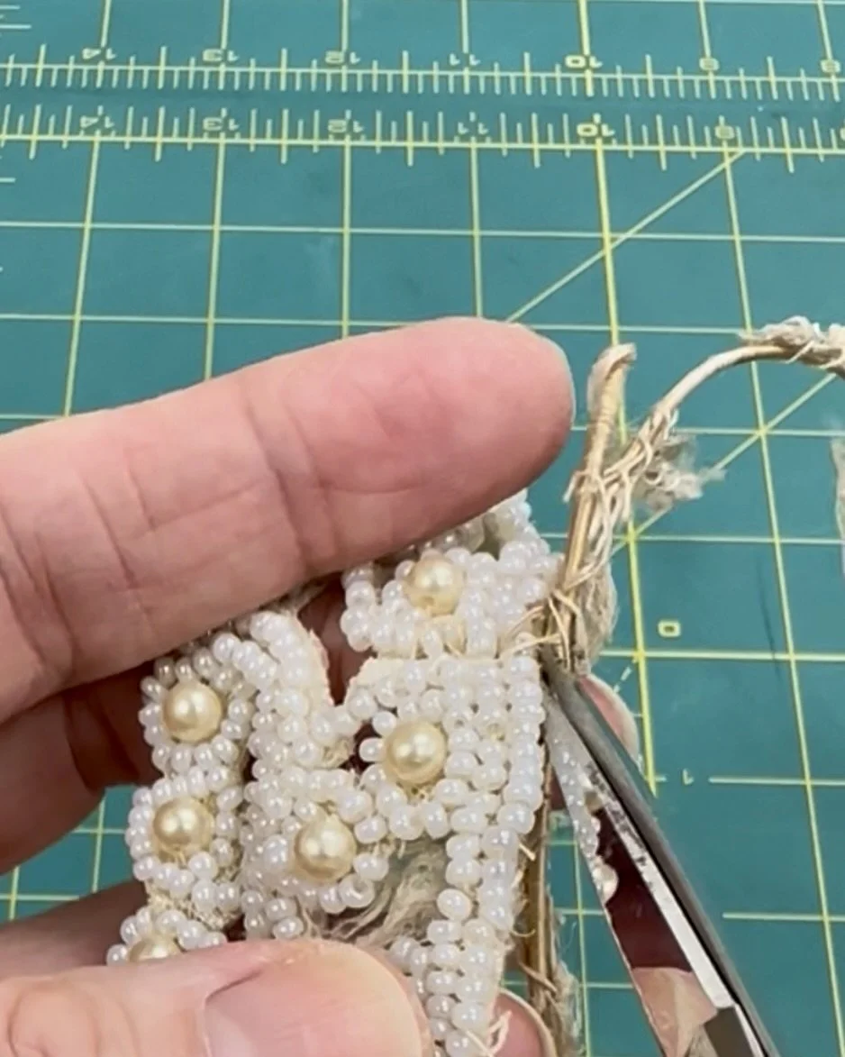 Deconstructing a vintage beaded wedding crown cutting away the original frame.